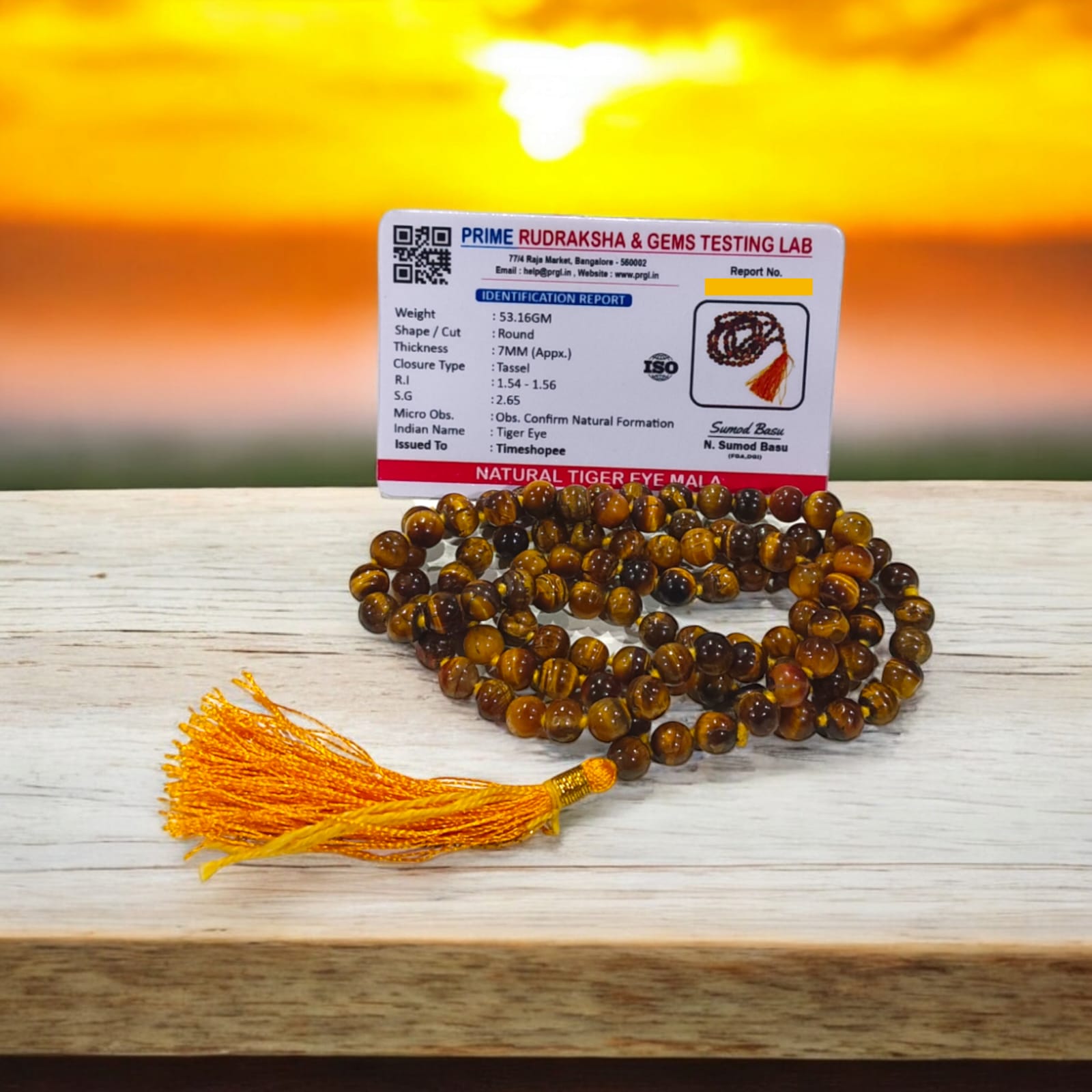 High-quality image of Tiger Eye Mala with natural golden-brown stone beads arranged in a traditional mala style