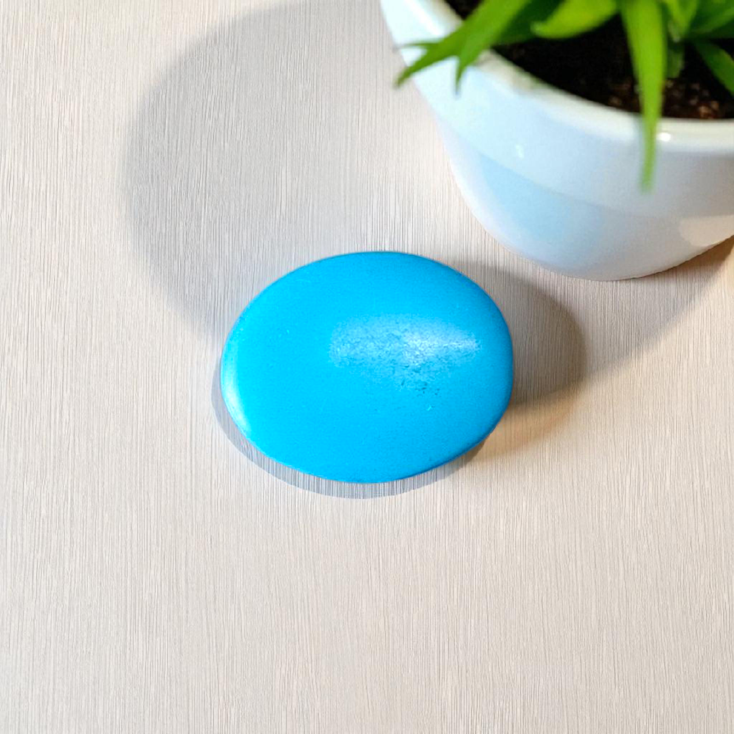 High-quality image of a natural turquoise (Firoza) gemstone with blue-green hues, polished surface, used for healing, confidence, and spiritual purposes