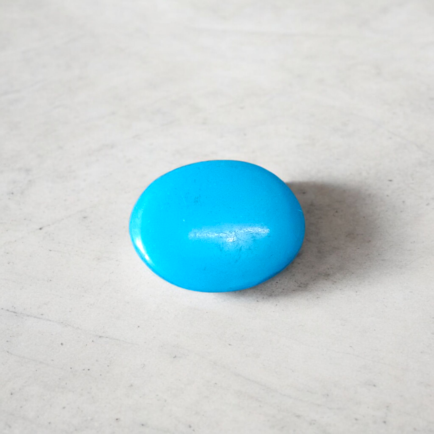 High-quality image of a natural turquoise (Firoza) gemstone with blue-green hues, polished surface, used for healing, confidence, and spiritual purposes