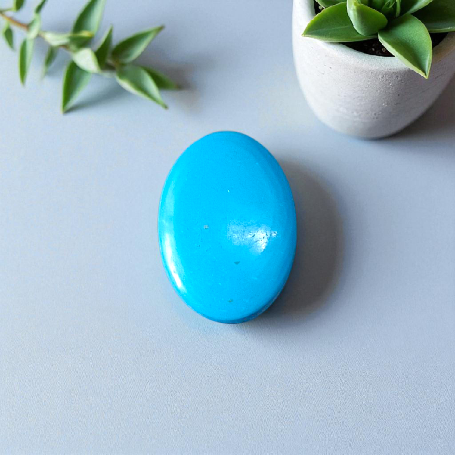 High-quality image of a natural turquoise (Firoza) gemstone with blue-green hues, polished surface, used for healing, confidence, and spiritual purposes