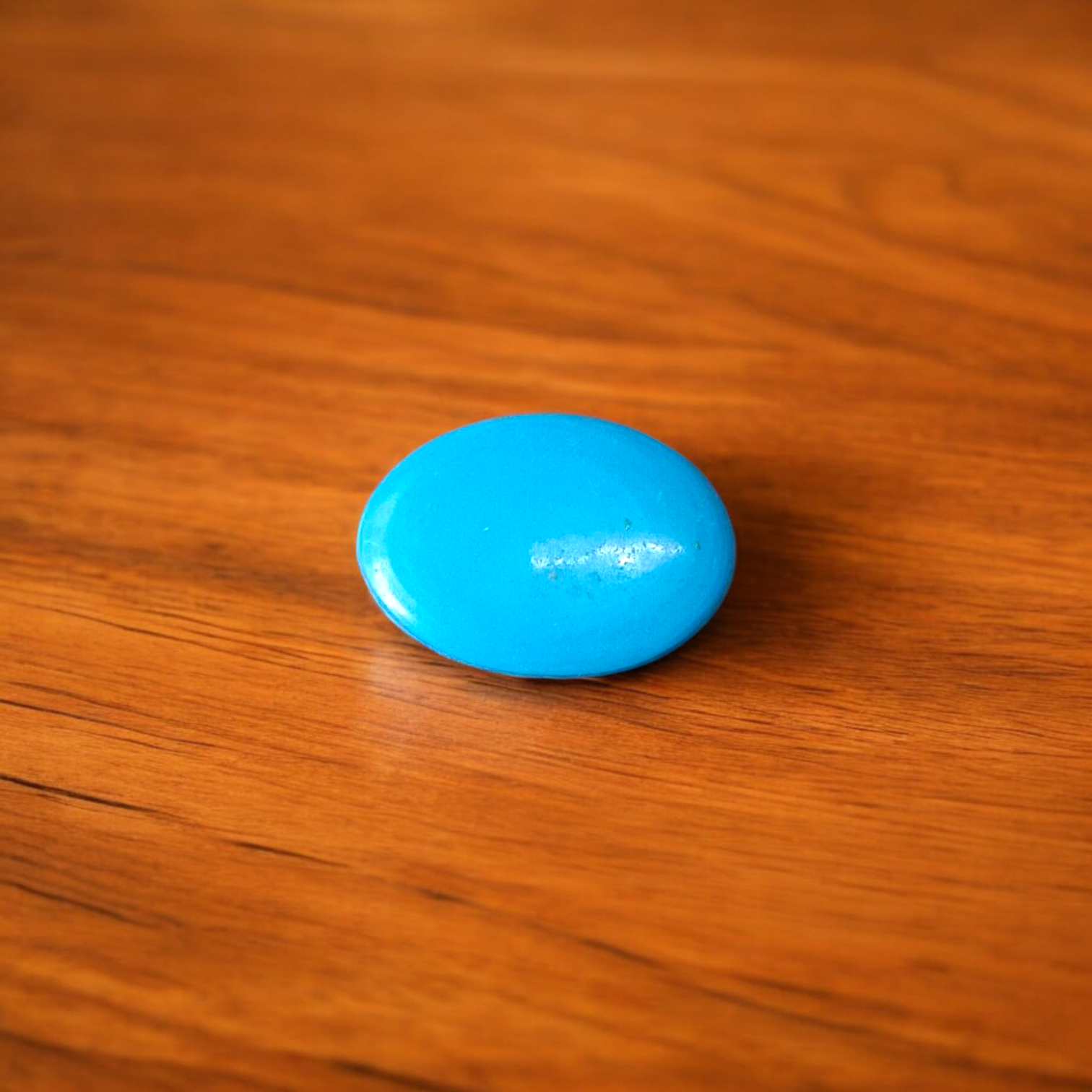 High-quality image of a natural turquoise (Firoza) gemstone with blue-green hues, polished surface, used for healing, confidence, and spiritual purposes