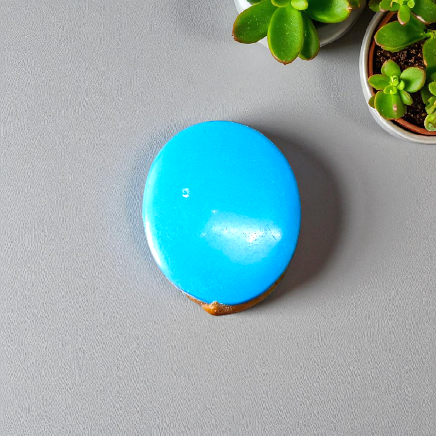 High-quality image of a natural turquoise (Firoza) gemstone with blue-green hues, polished surface, used for healing, confidence, and spiritual purposes