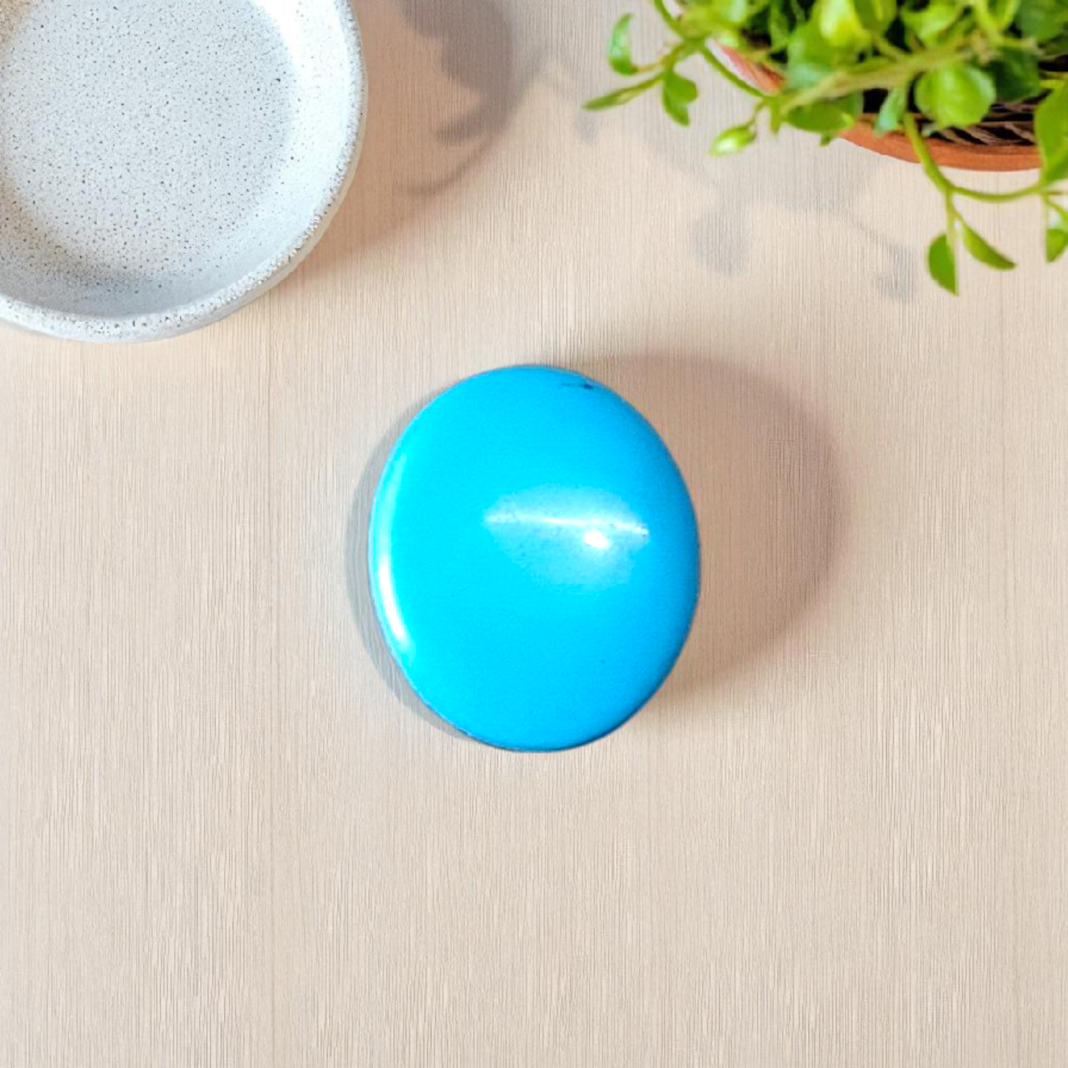 High-quality image of a natural turquoise (Firoza) gemstone with blue-green hues, polished surface, used for healing, confidence, and spiritual purposes