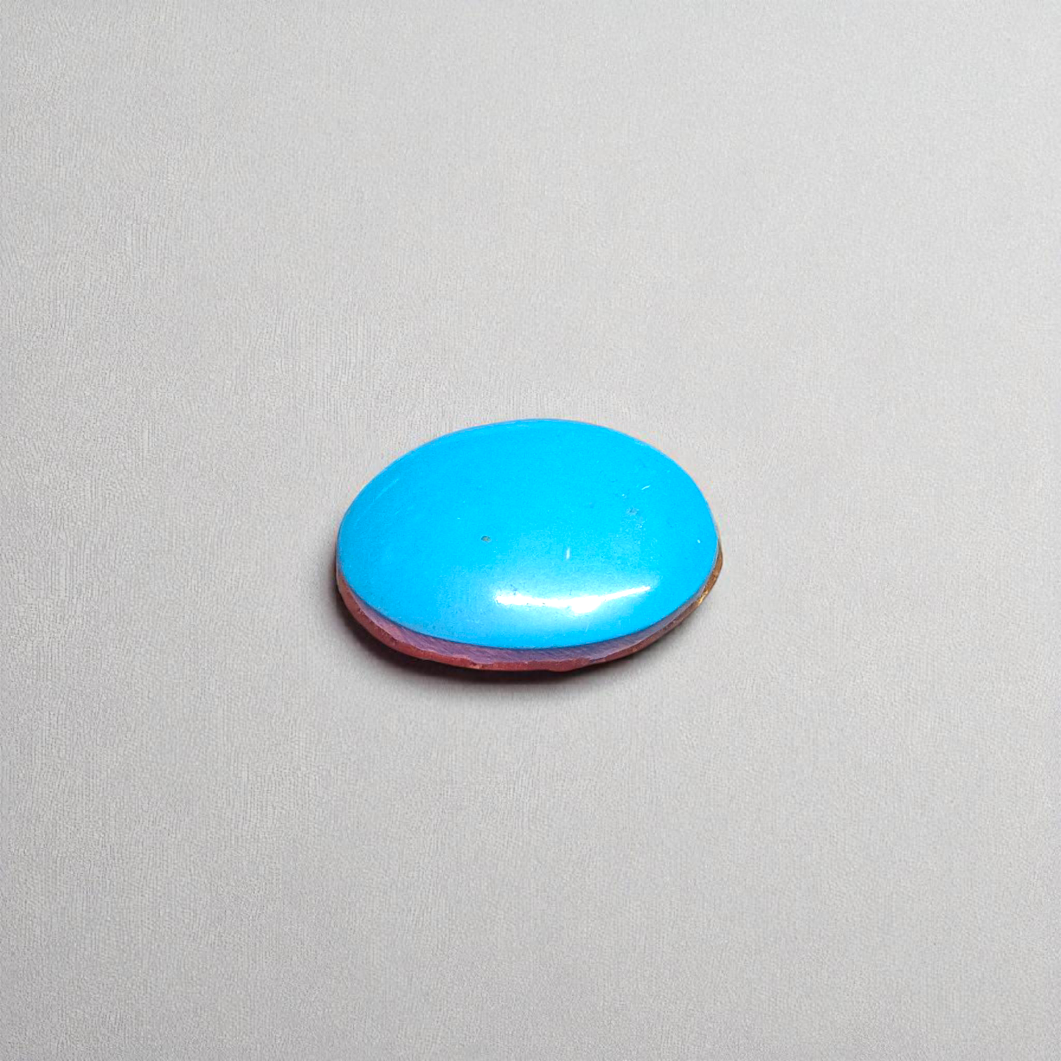 High-quality image of a natural turquoise (Firoza) gemstone with blue-green hues, polished surface, used for healing, confidence, and spiritual purposes