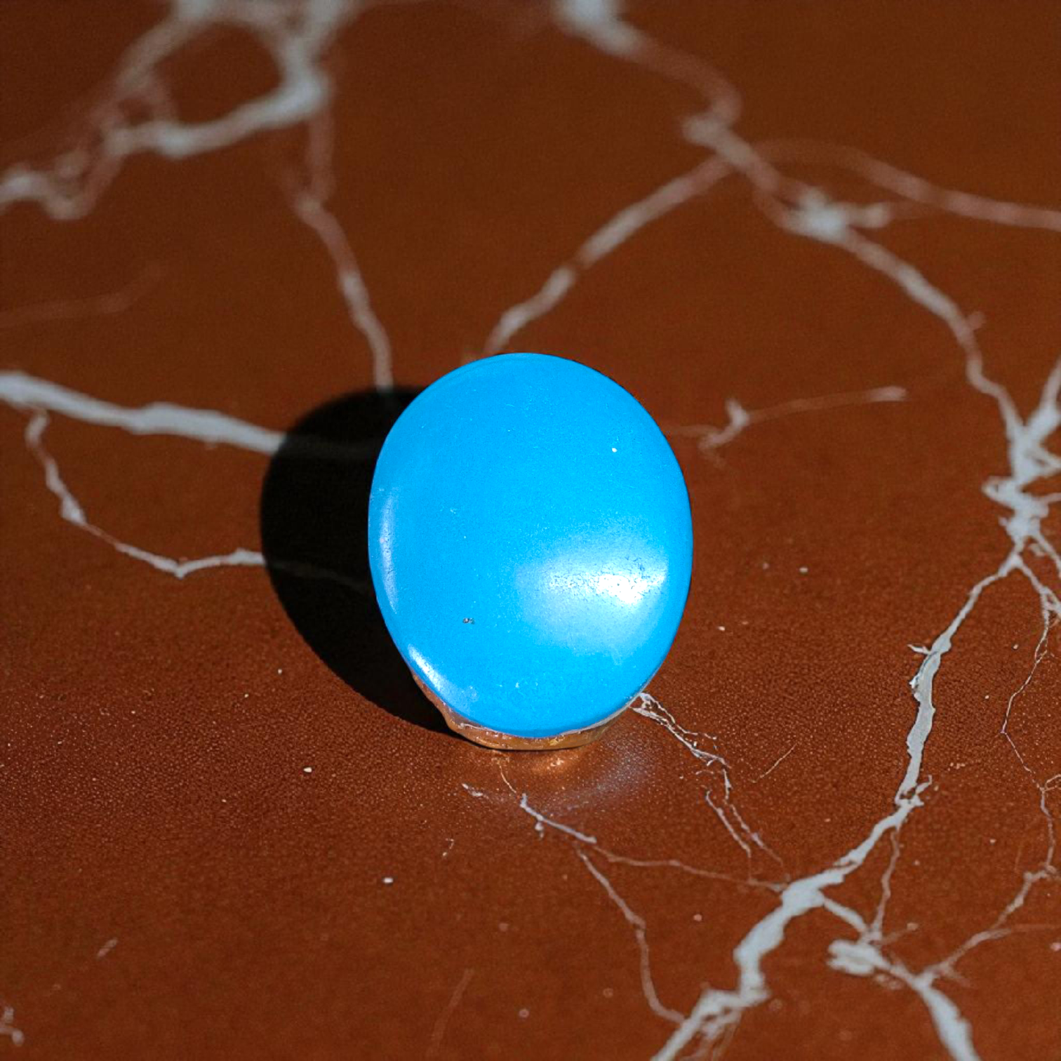 High-quality image of a natural turquoise (Firoza) gemstone with blue-green hues, polished surface, used for healing, confidence, and spiritual purposes