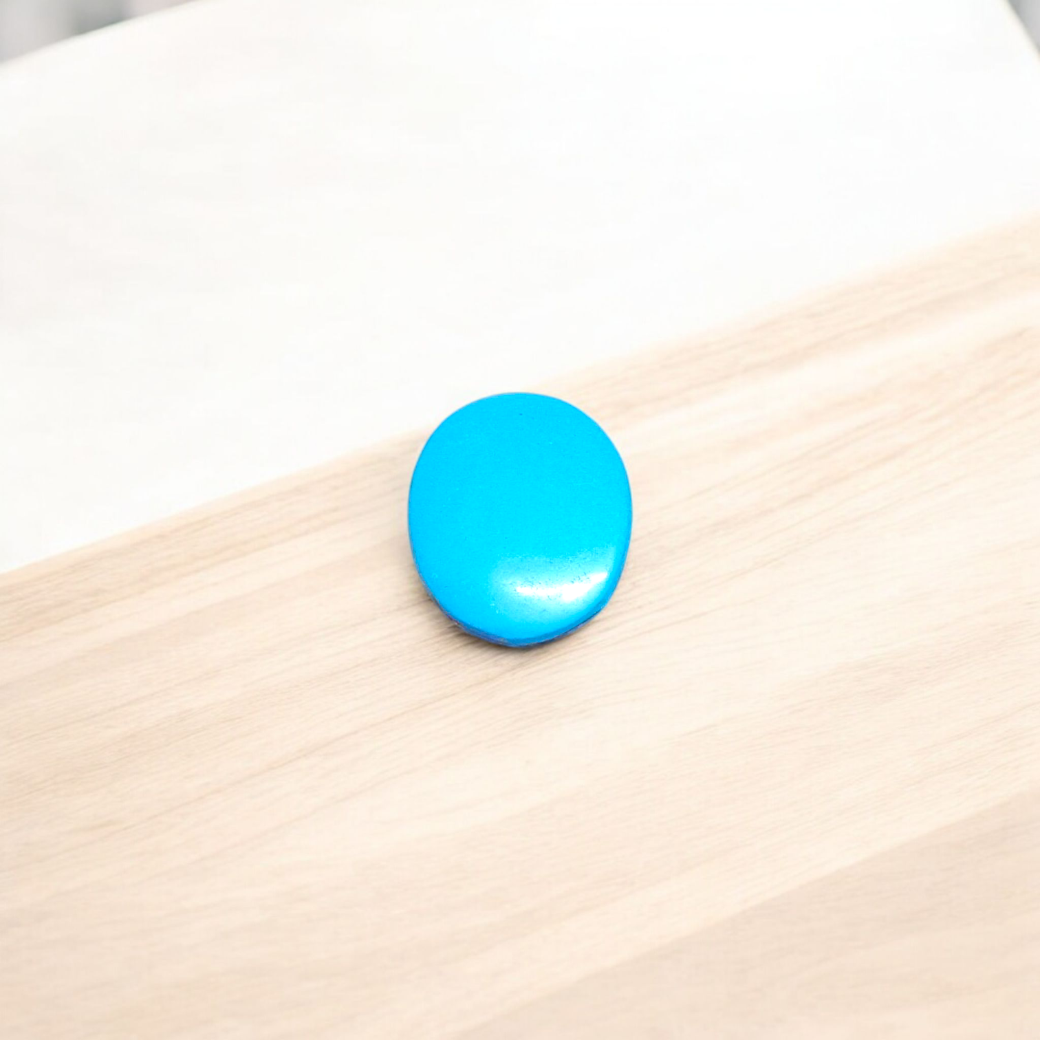 High-quality image of a natural turquoise (Firoza) gemstone with blue-green hues, polished surface, used for healing, confidence, and spiritual purposes