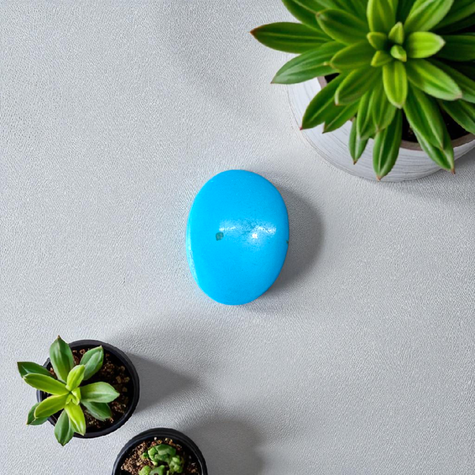 High-quality image of a natural turquoise (Firoza) gemstone with blue-green hues, polished surface, used for healing, confidence, and spiritual purposes