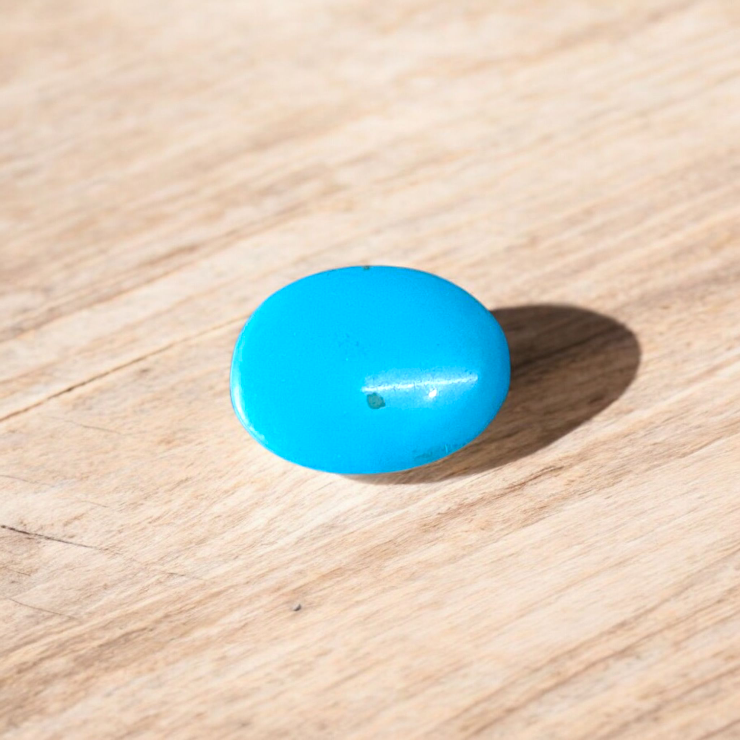 High-quality image of a natural turquoise (Firoza) gemstone with blue-green hues, polished surface, used for healing, confidence, and spiritual purposes