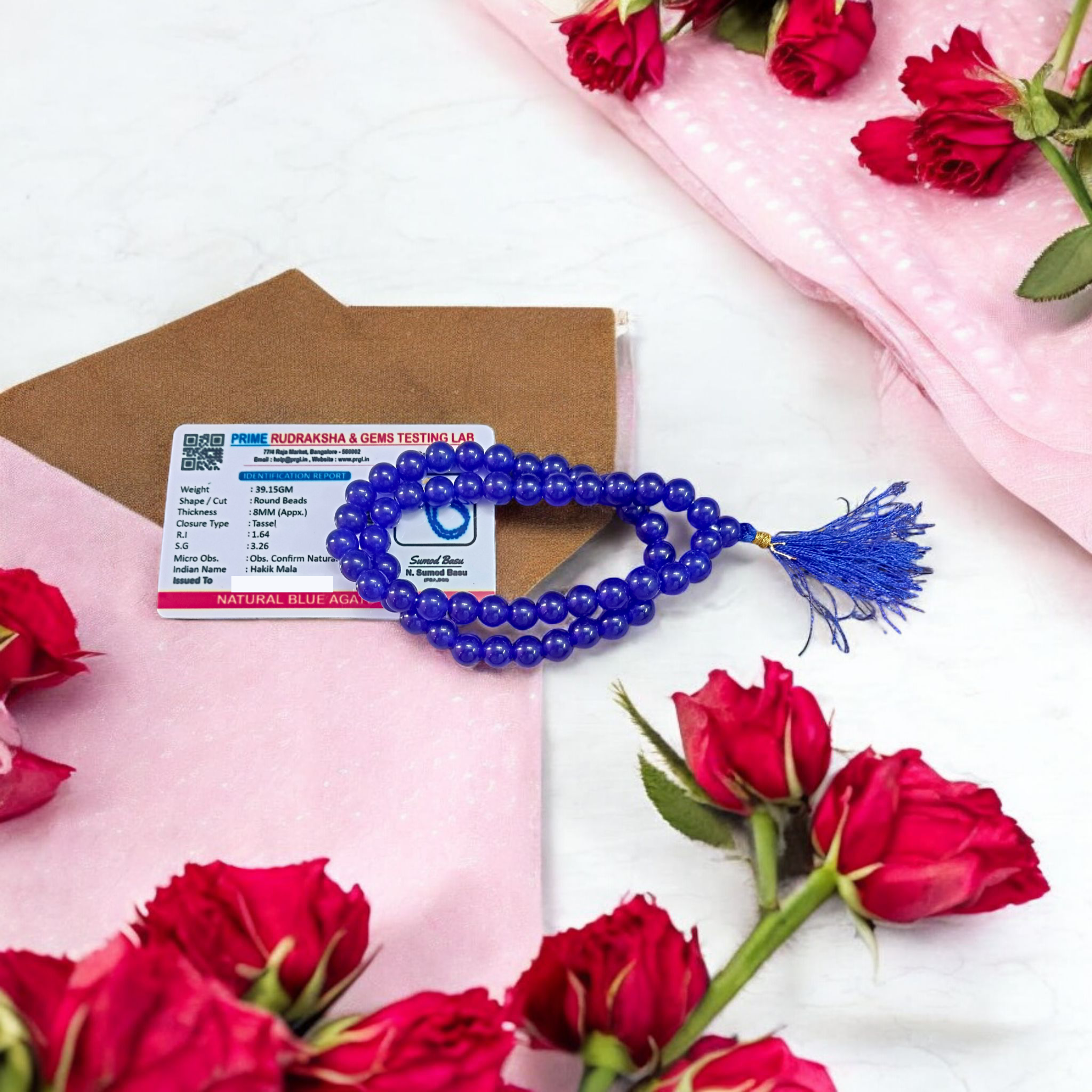 Image of Blue Agate Mala featuring 54+1 polished 8mm blue beads, neatly strung for mantra chanting, meditation, and spiritual growth