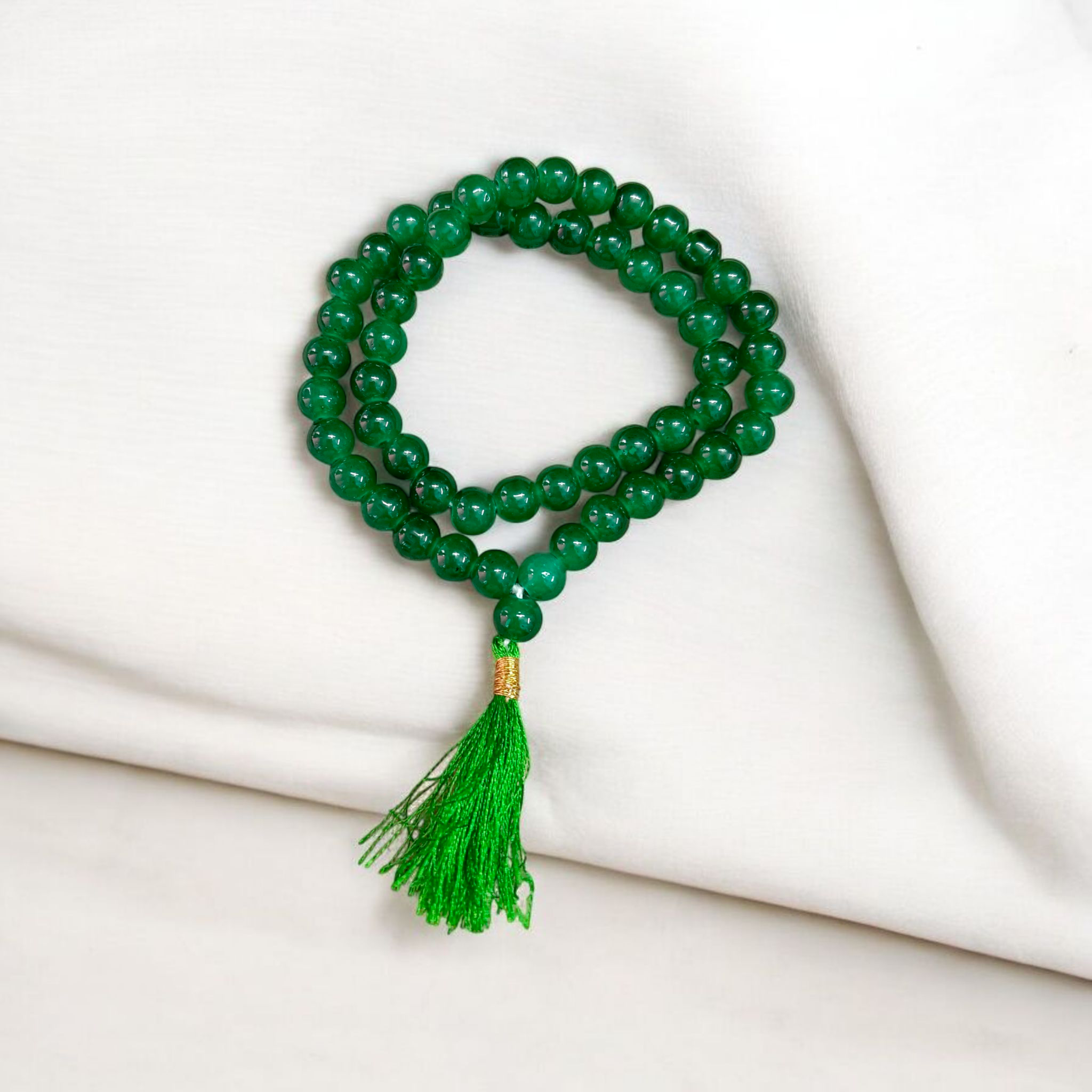 Image of Green Agate Mala made with 54+1 natural 8mm green beads, arranged neatly for japa, meditation, and spiritual healing practices
