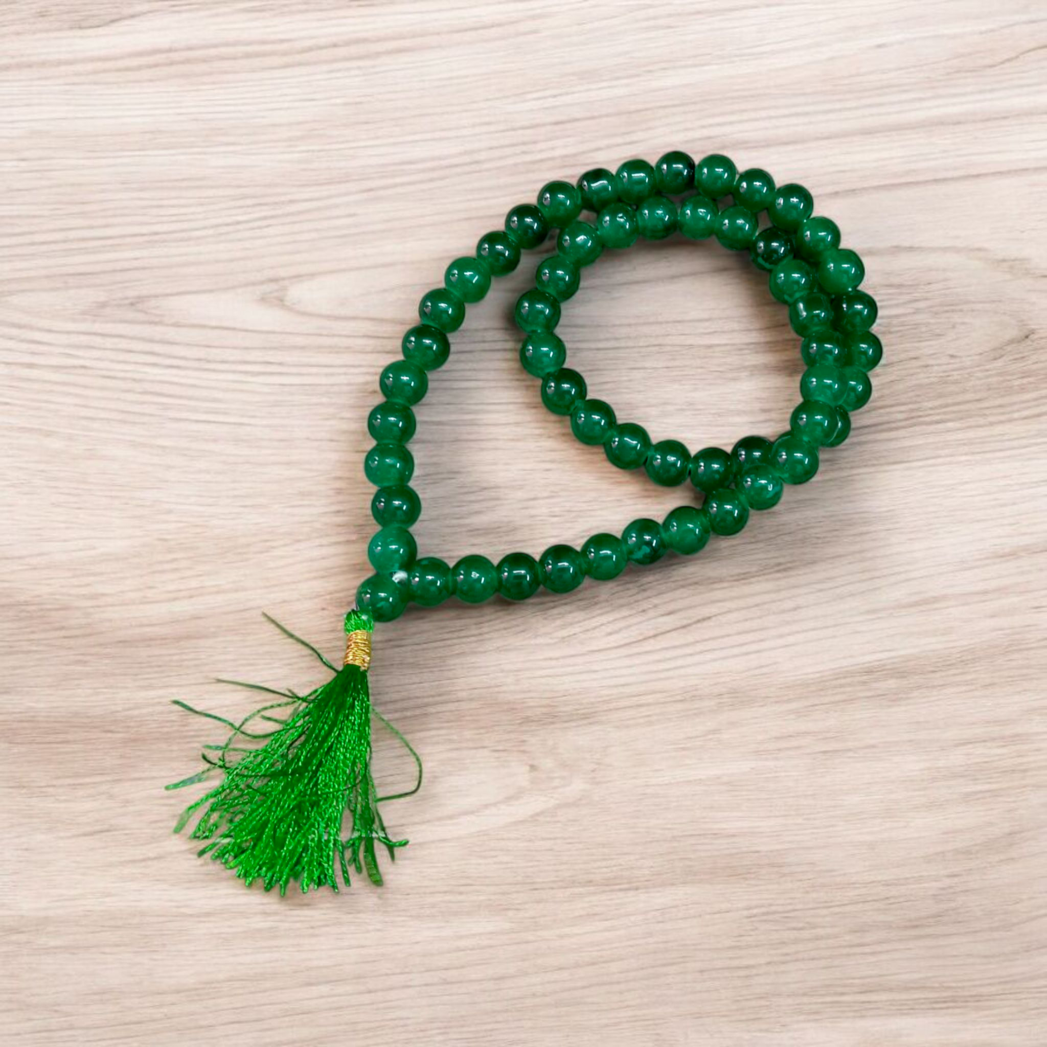 Image of Green Agate Mala made with 54+1 natural 8mm green beads, arranged neatly for japa, meditation, and spiritual healing practices