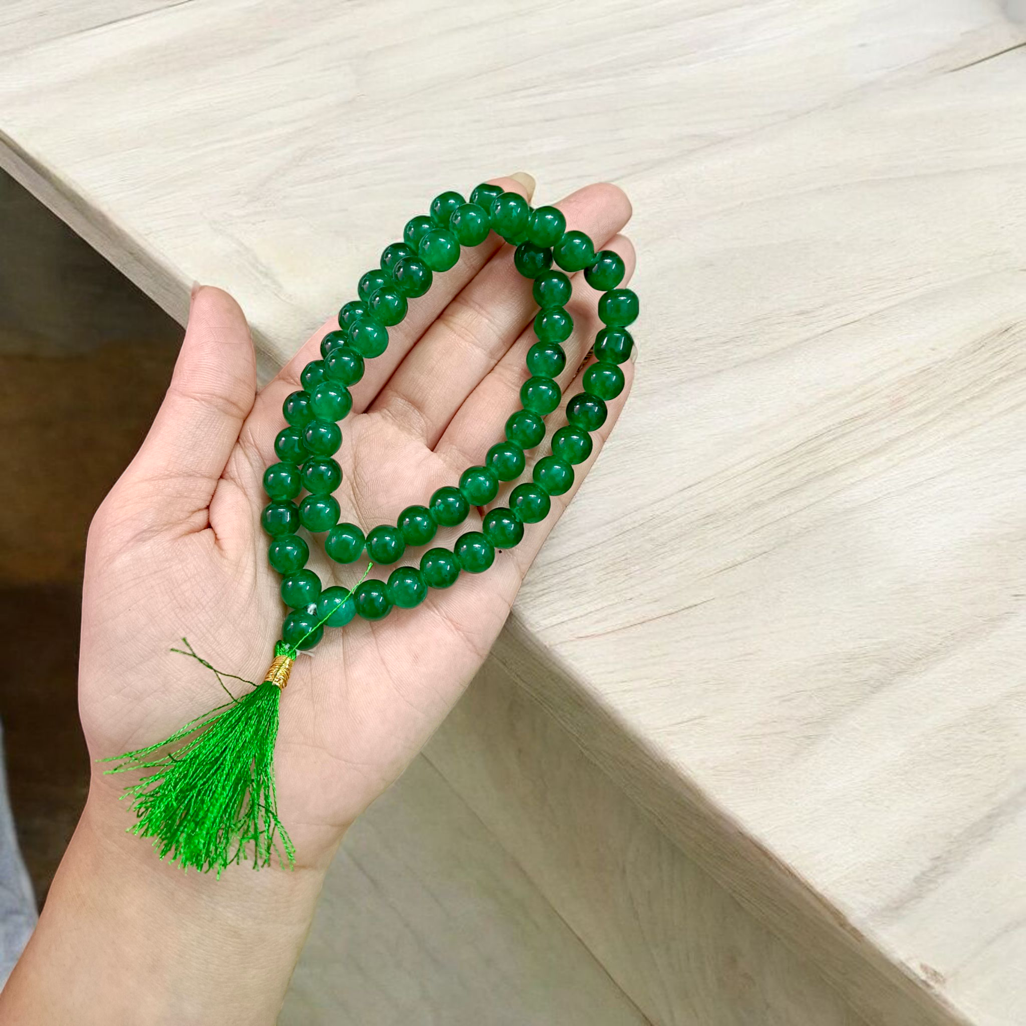 Image of Green Agate Mala made with 54+1 natural 8mm green beads, arranged neatly for japa, meditation, and spiritual healing practices