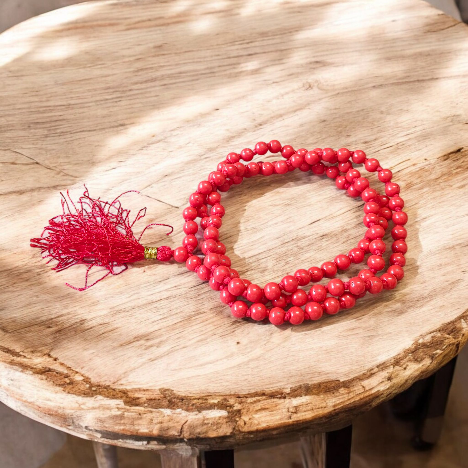 Image of Lal Moonga Mala (Red Coral Mala) made of 108+1 natural red coral beads, size 6mm, neatly strung, ideal for puja, astrology, and meditation
