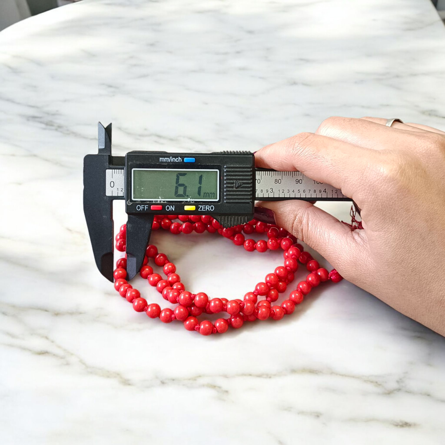 Image of Lal Moonga Mala (Red Coral Mala) made of 108+1 natural red coral beads, size 6mm, neatly strung, ideal for puja, astrology, and meditation