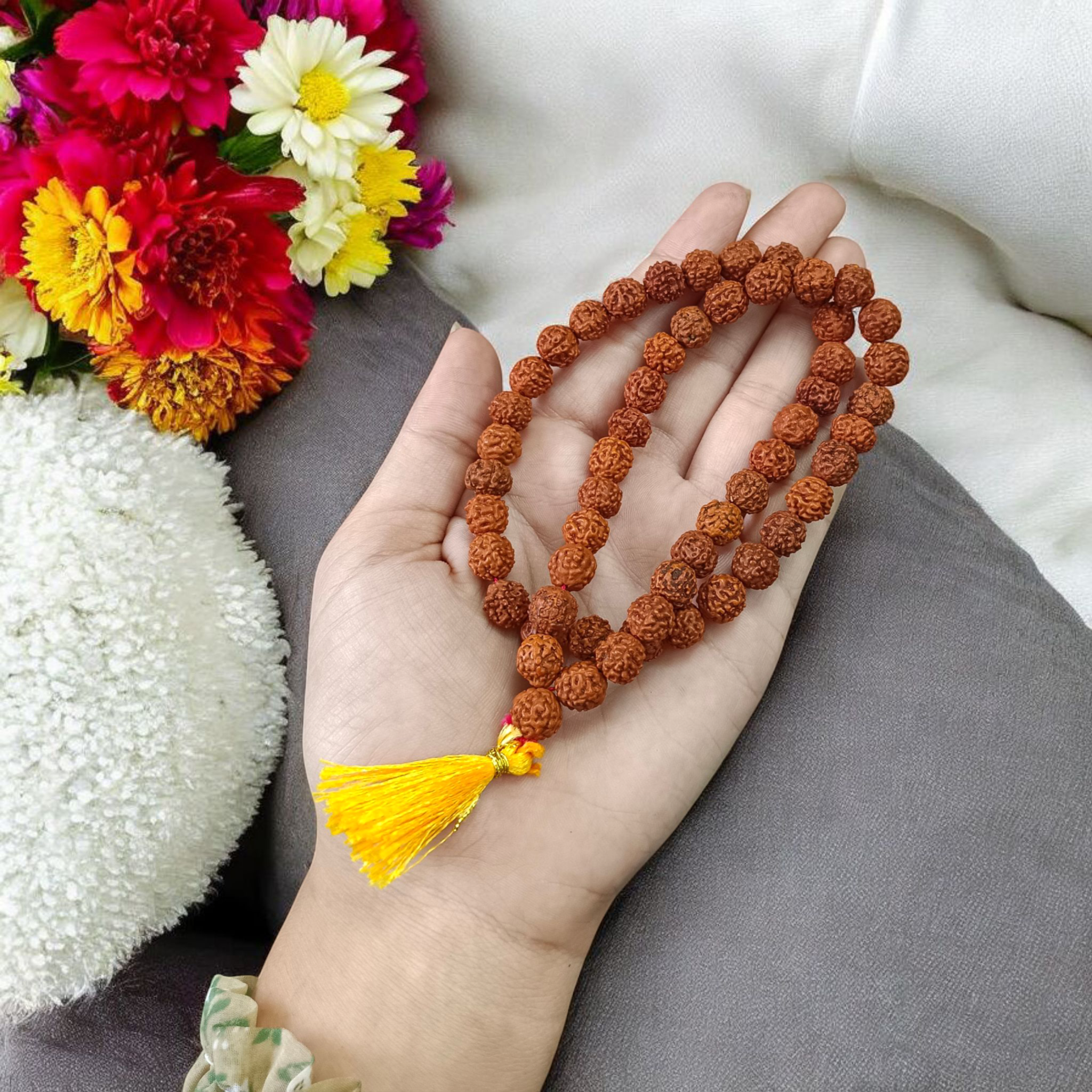 Image of Natural 5 Mukhi Rudraksha Jaap Mala made of 8mm round brown beads, arranged neatly for chanting and meditation purposes