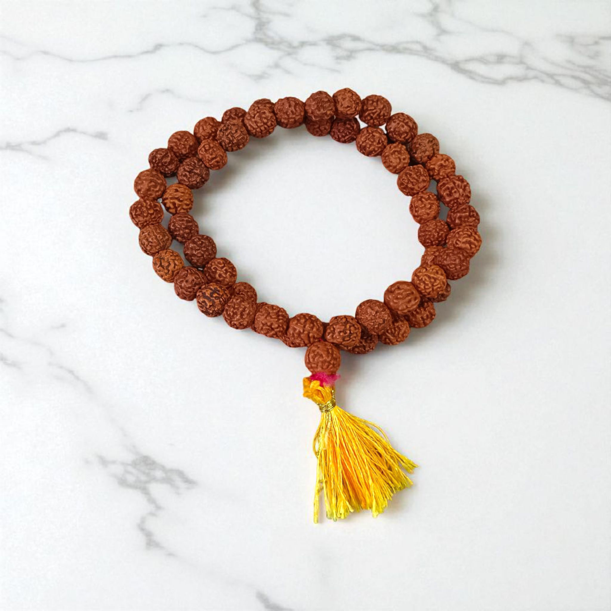 Image of Natural 5 Mukhi Rudraksha Jaap Mala made of 8mm round brown beads, arranged neatly for chanting and meditation purposes