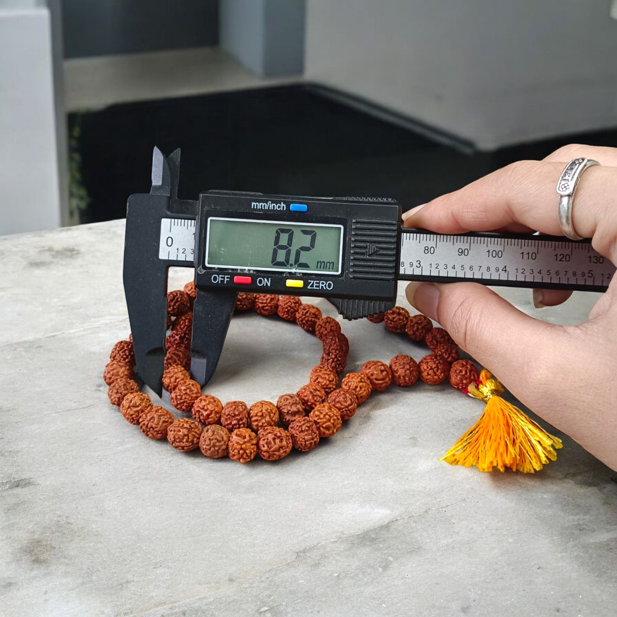 Image of Natural 5 Mukhi Rudraksha Jaap Mala made of 8mm round brown beads, arranged neatly for chanting and meditation purposes