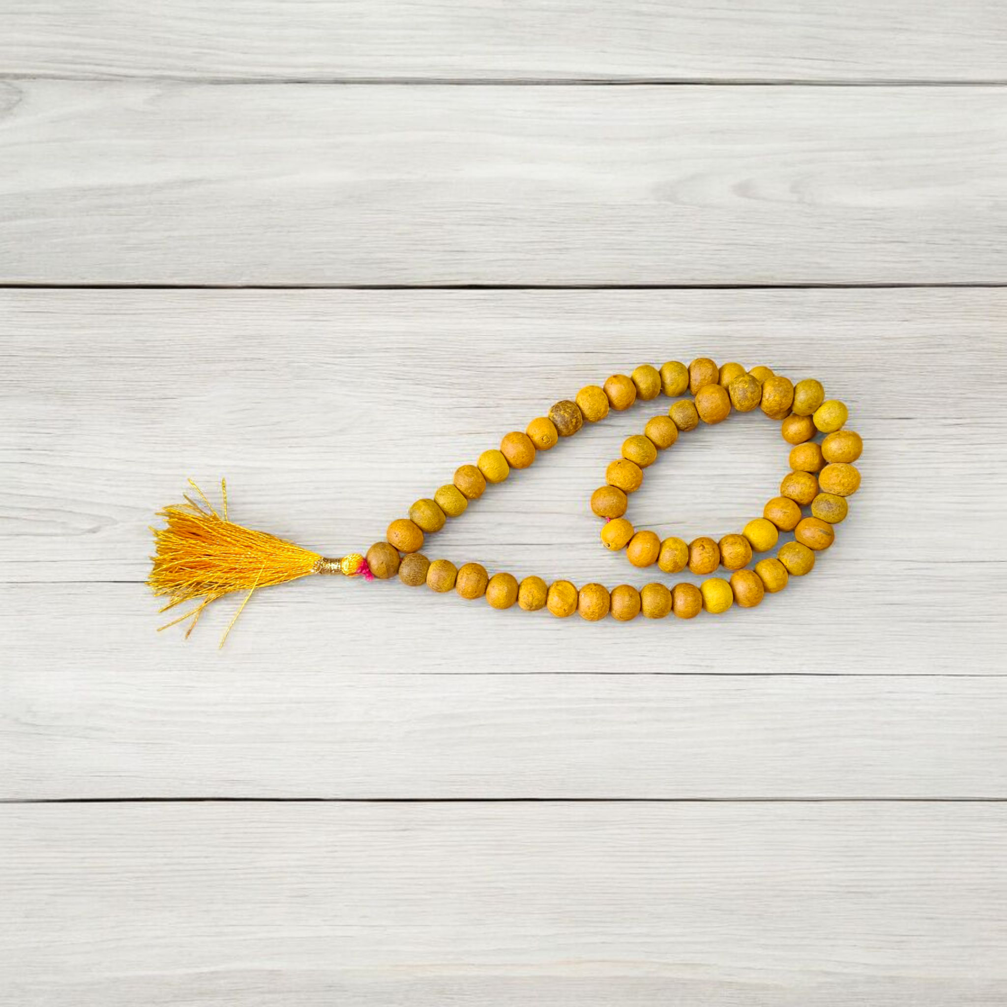 Image of Natural Haldi (Turmeric) Mala with 54+1 hand-knotted 7mm beads, lab certified, offered by Timeshopee – Online Religious Store