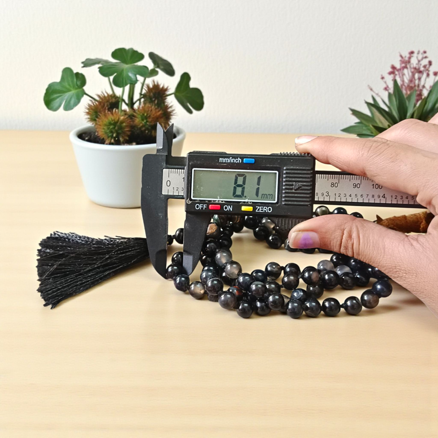 Image of Natural Sulemani Hakik Mala (Black Agate) with 8MM smooth round beads, available in 108+1 and 27+1 configurations, used for meditation and daily wear