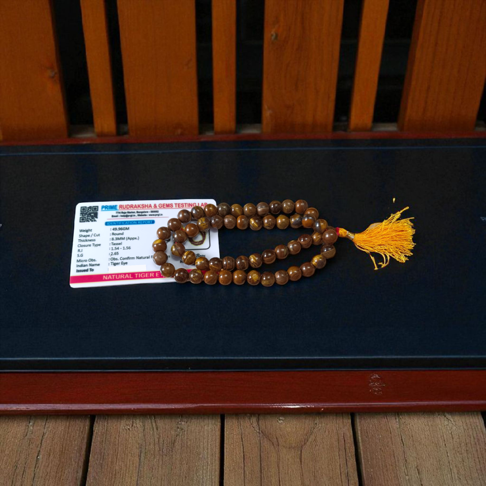Image of Natural Tiger Eye Mala with 54+1 hand-knotted 8mm lab-certified beads, used for grounding, meditation, and spiritual wear — sold by Timeshopee