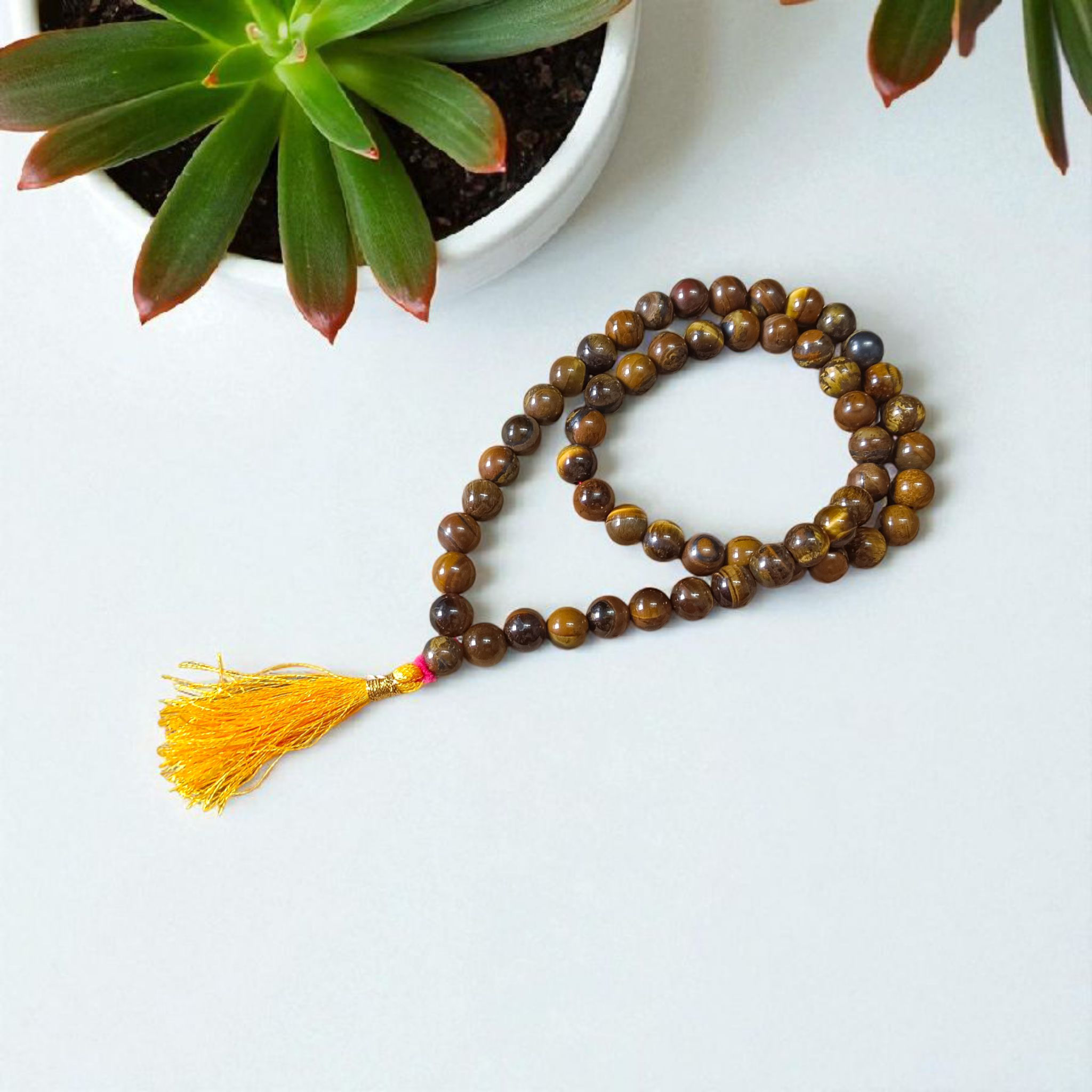 Image of Natural Tiger Eye Mala with 54+1 hand-knotted 8mm lab-certified beads, used for grounding, meditation, and spiritual wear — sold by Timeshopee
