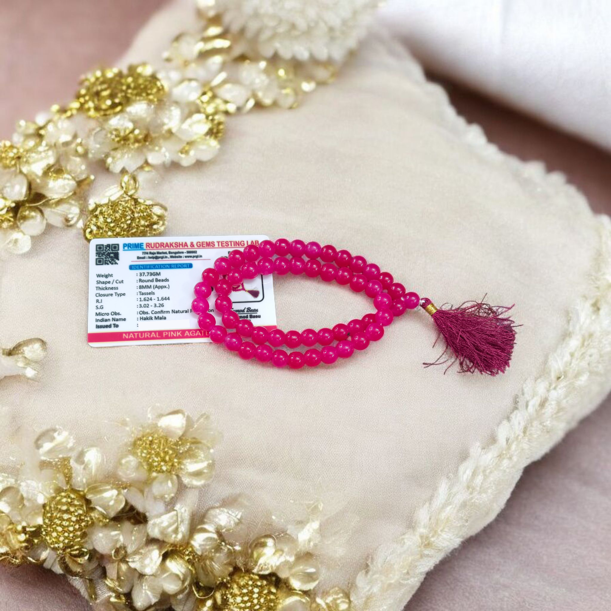 Image of Pink Agate Mala with 54+1 polished 8mm pink beads, ideal for mantra chanting, emotional healing, and meditation, displayed on a neutral background