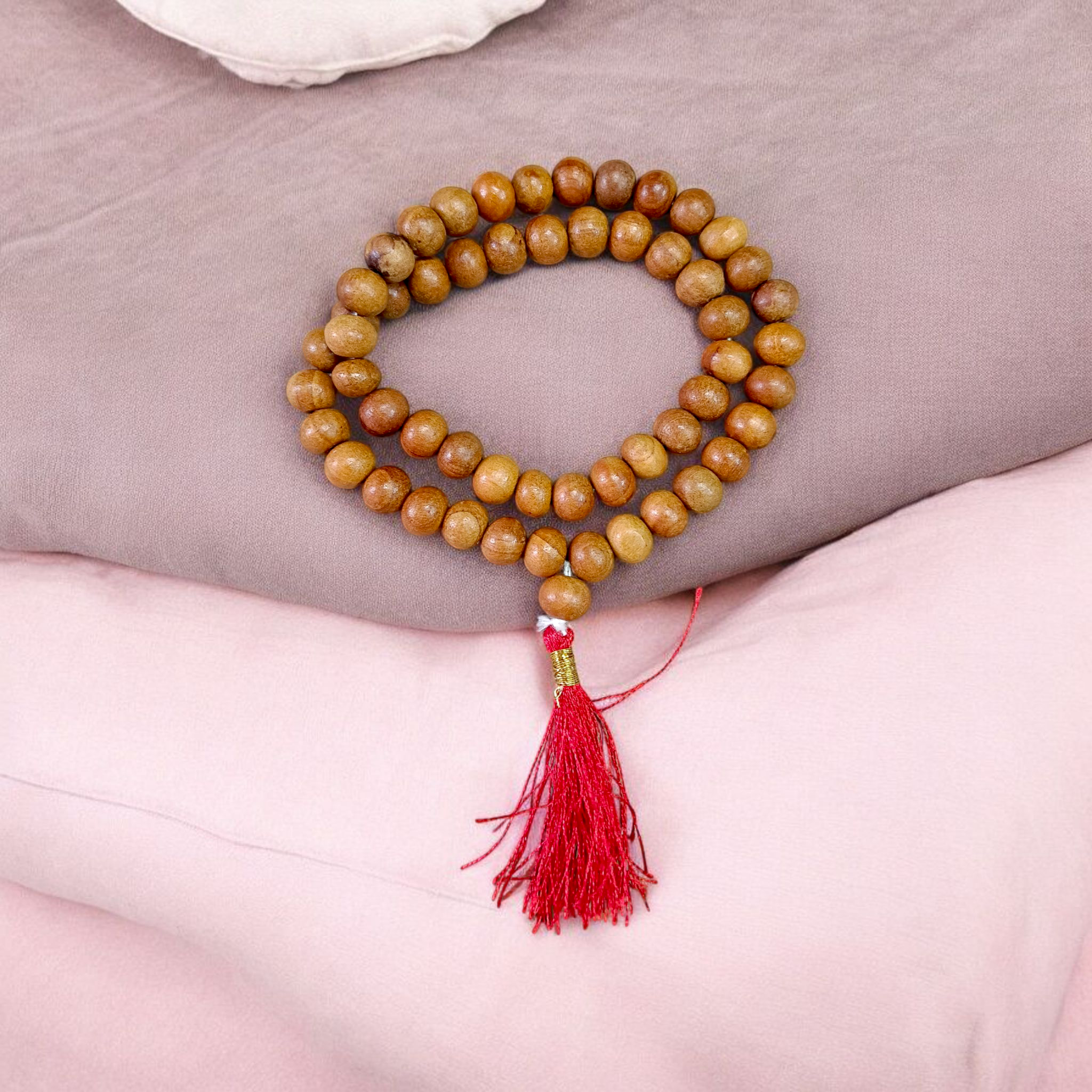 Image of Safed Chandan Mala with 54+1 smooth 8mm white sandalwood beads, naturally fragrant, arranged for meditation, chanting, and spiritual peace