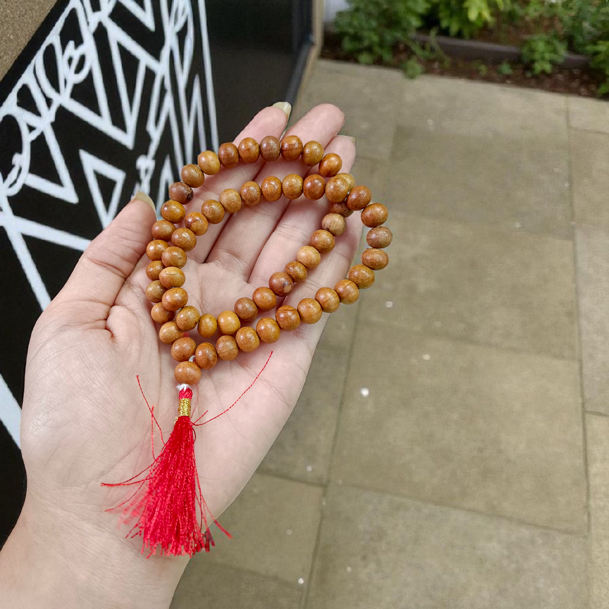 Image of Safed Chandan Mala with 54+1 smooth 8mm white sandalwood beads, naturally fragrant, arranged for meditation, chanting, and spiritual peace