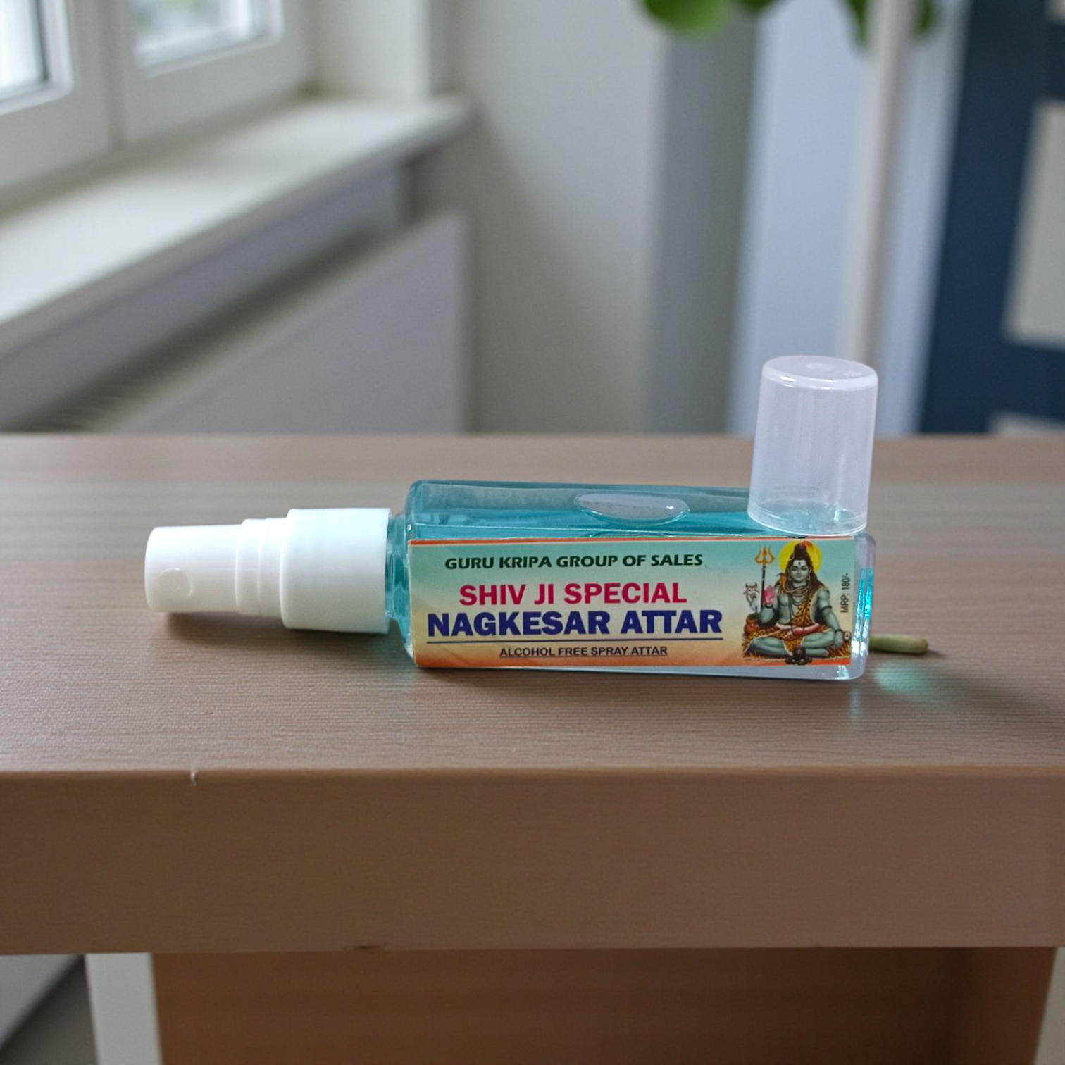 Image of a 25ML Shiv Ji Special NagKesar Spray Attar bottle featuring elegant packaging, labeled as 100% alcohol-free and long-lasting for spiritual balance