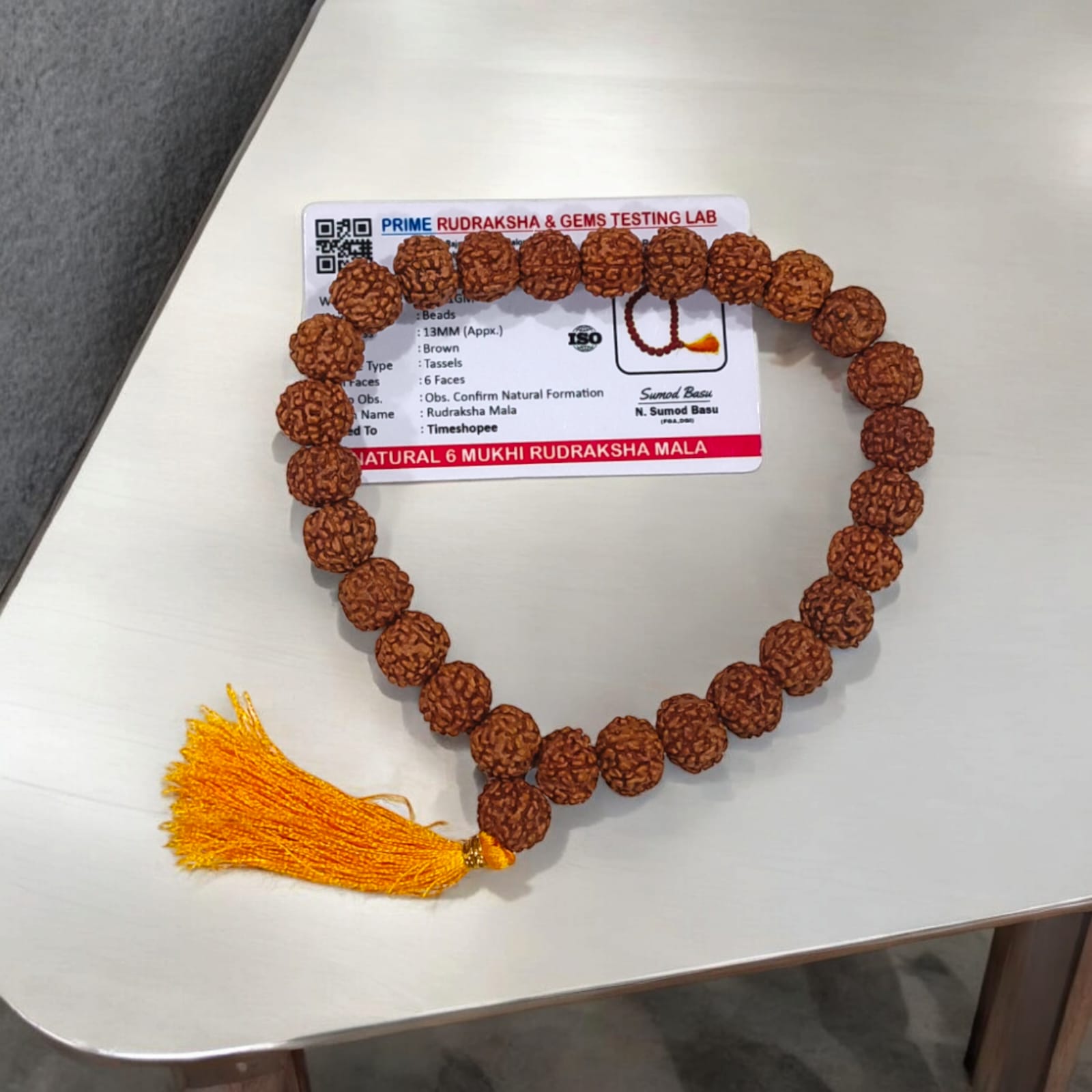 Image of a Lab Certified 6 Mukhi Rudraksha Mala from Timeshopee, available in 27+1 and 108+1 bead variants, used for meditation and spiritual purposes.