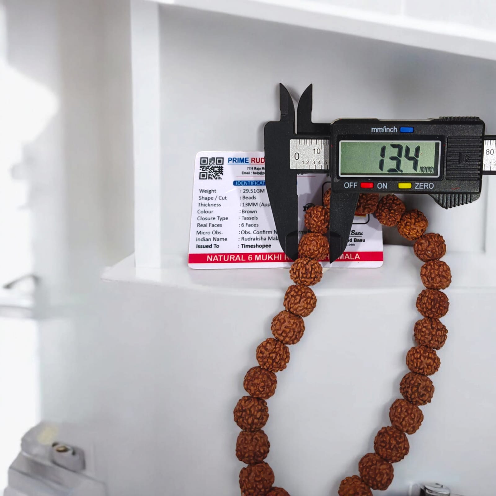 Image of a Lab Certified 6 Mukhi Rudraksha Mala from Timeshopee, available in 27+1 and 108+1 bead variants, used for meditation and spiritual purposes.