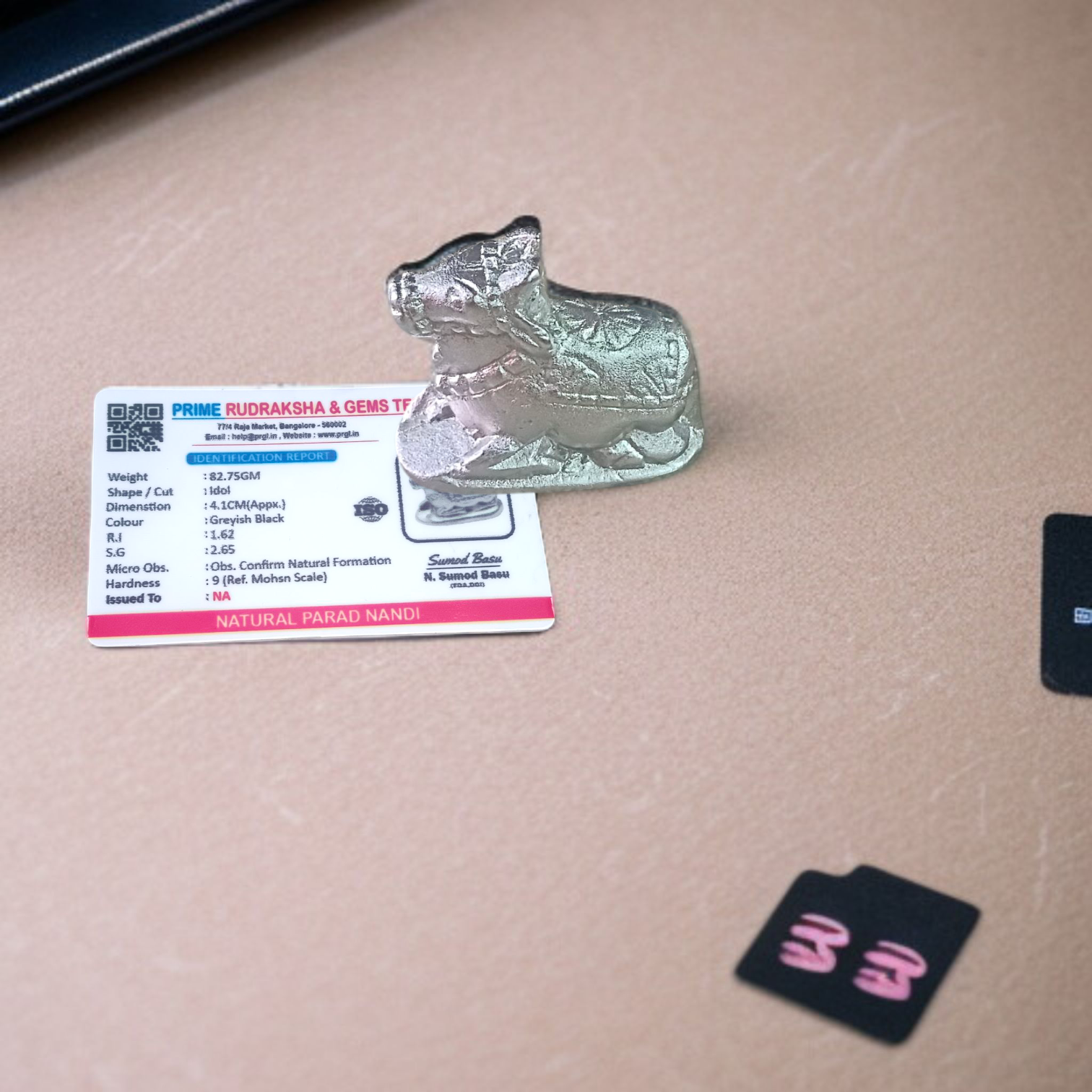 Image of a Natural Parad Nandi Idol made from mercury alloy, placed on a clean surface, reflecting divine and traditional craftsmanship