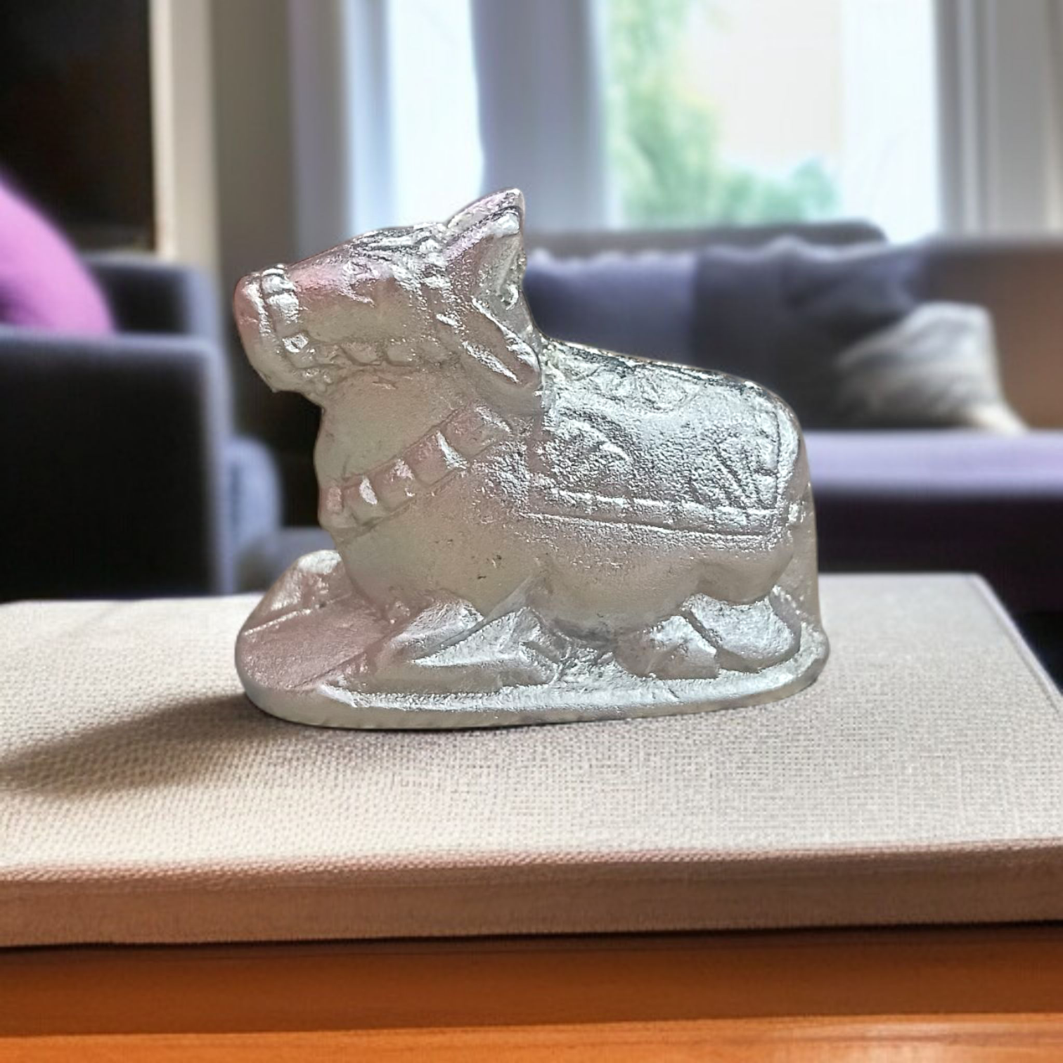 Image of a Natural Parad Nandi Idol made from mercury alloy, placed on a clean surface, reflecting divine and traditional craftsmanship