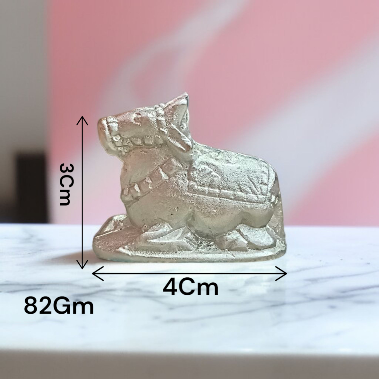 Image of a Natural Parad Nandi Idol made from mercury alloy, placed on a clean surface, reflecting divine and traditional craftsmanship