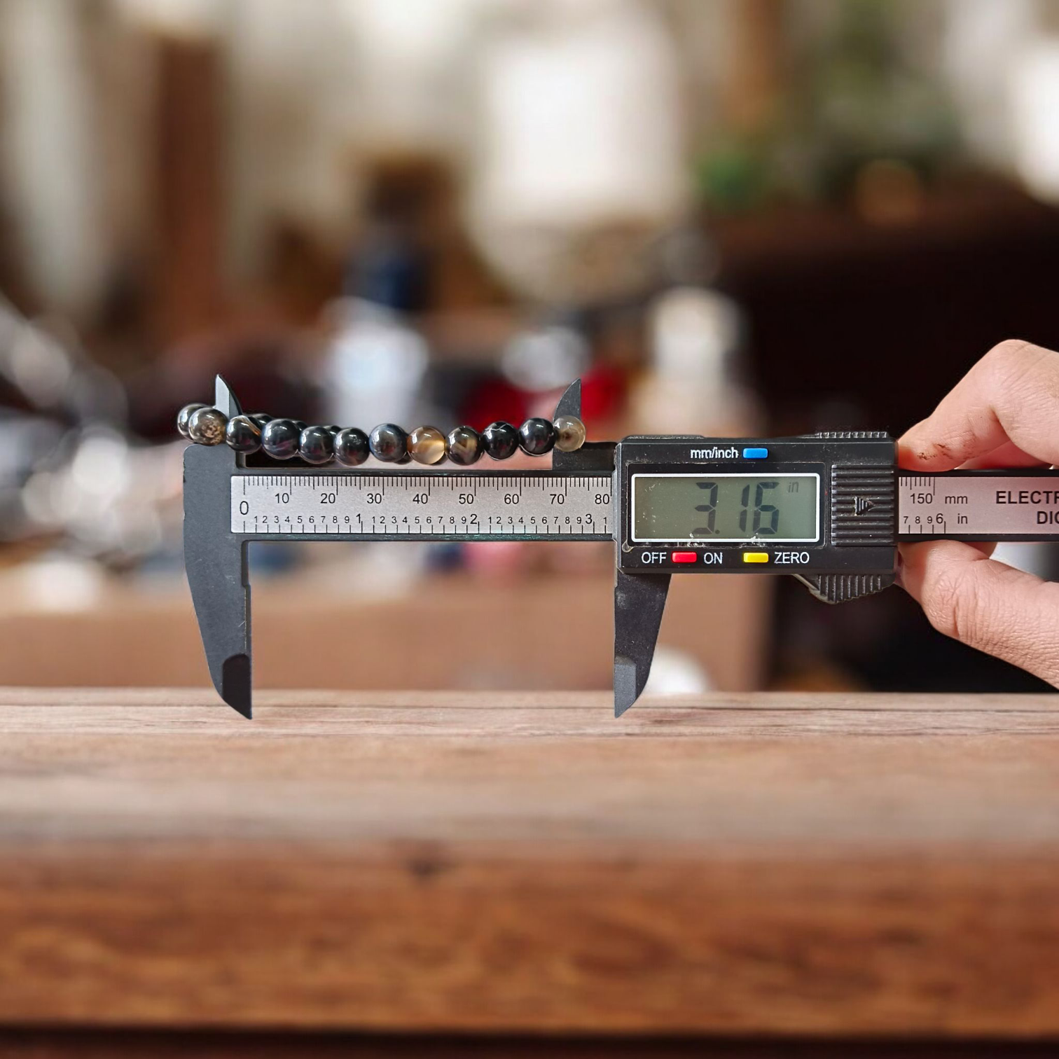 Image of a Natural Sulemani Hakik Bracelet with 8MM round Black Agate beads, stretchable to fit most wrists, designed for healing, protection, and daily wear