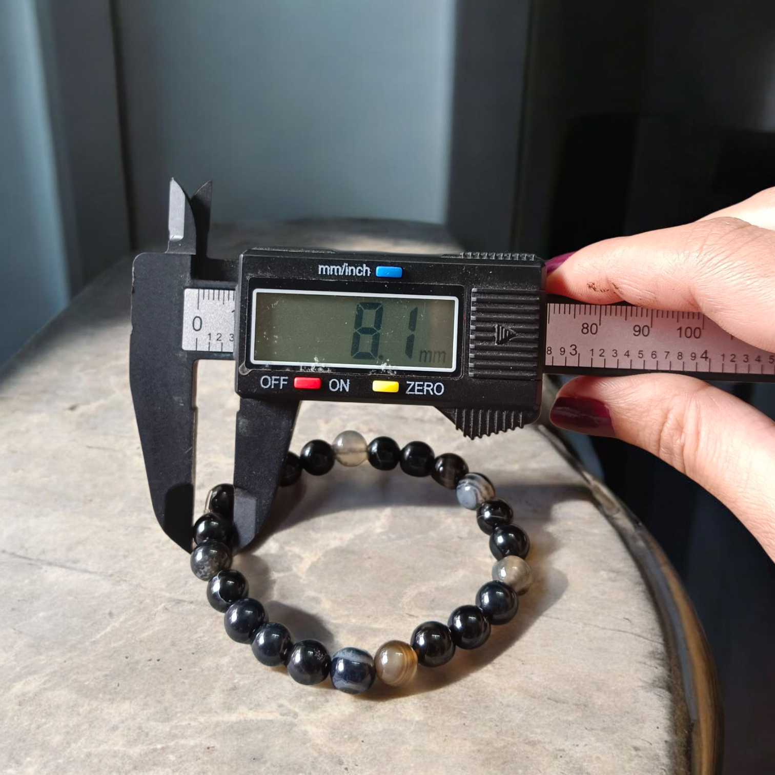 Image of a Natural Sulemani Hakik Bracelet with 8MM round Black Agate beads, stretchable to fit most wrists, designed for healing, protection, and daily wear