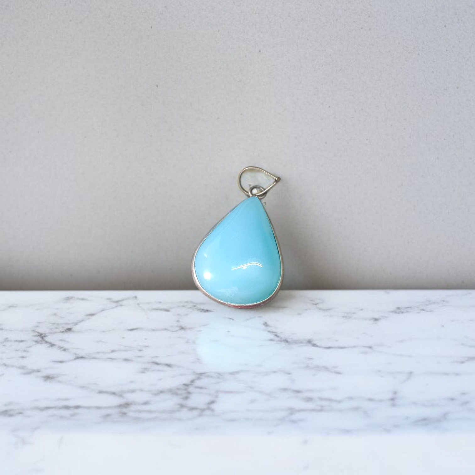 Image of a handcrafted, lab-certified original turquoise (Firoza) pendant designed for healing, meditation, and daily wear