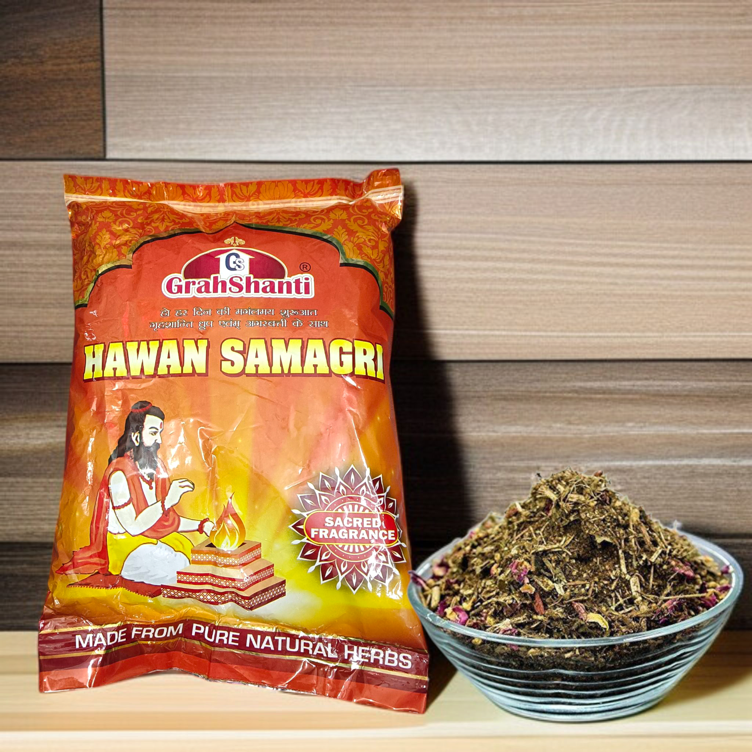 Image showing a 500GM pack of Hawan Samagri containing colorful natural herbs and powders used for Vedic rituals, placed beside puja essentials