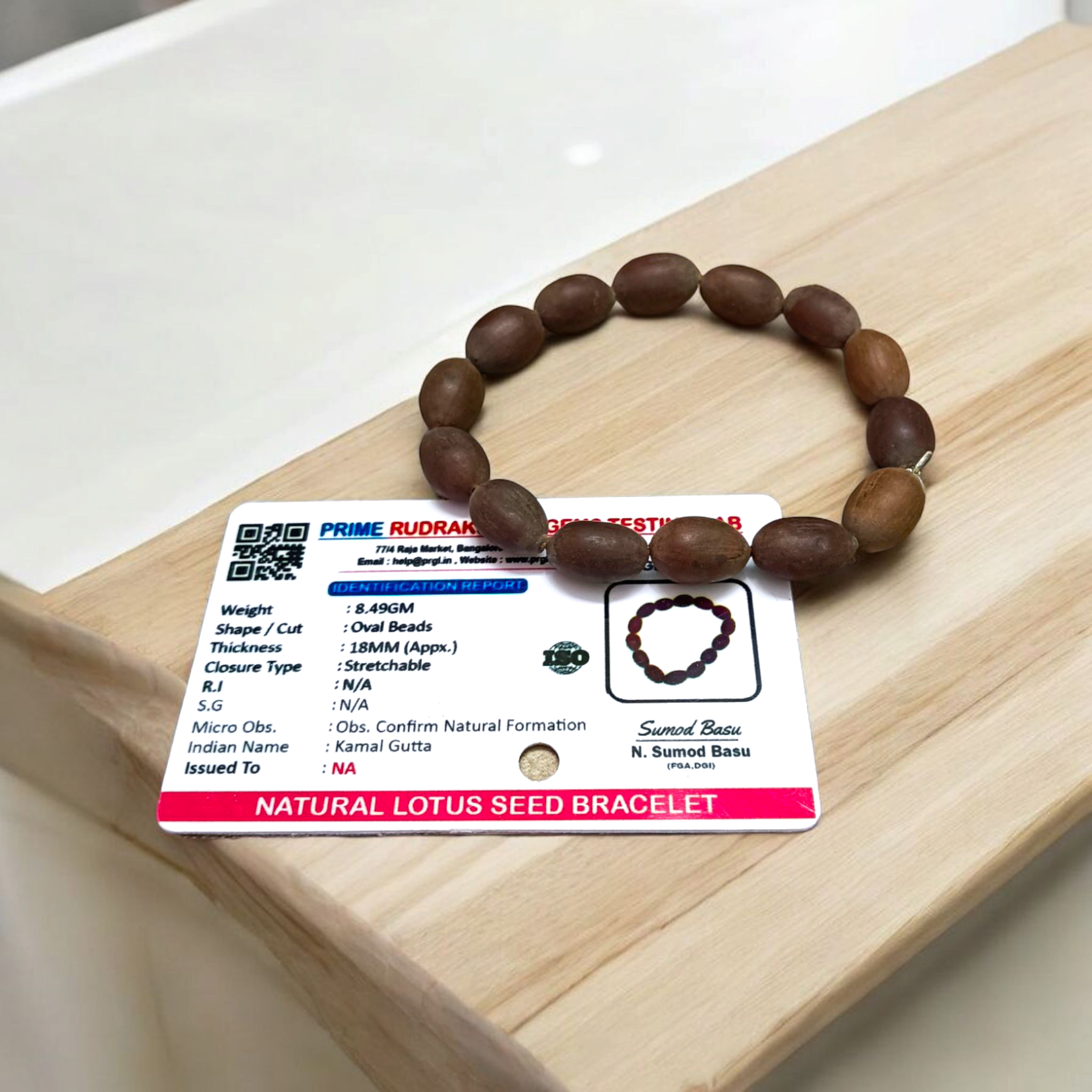 Image showing a handcrafted Kamal Gutta Bracelet made from 100% original lotus seeds, placed on a spiritual background with natural light.