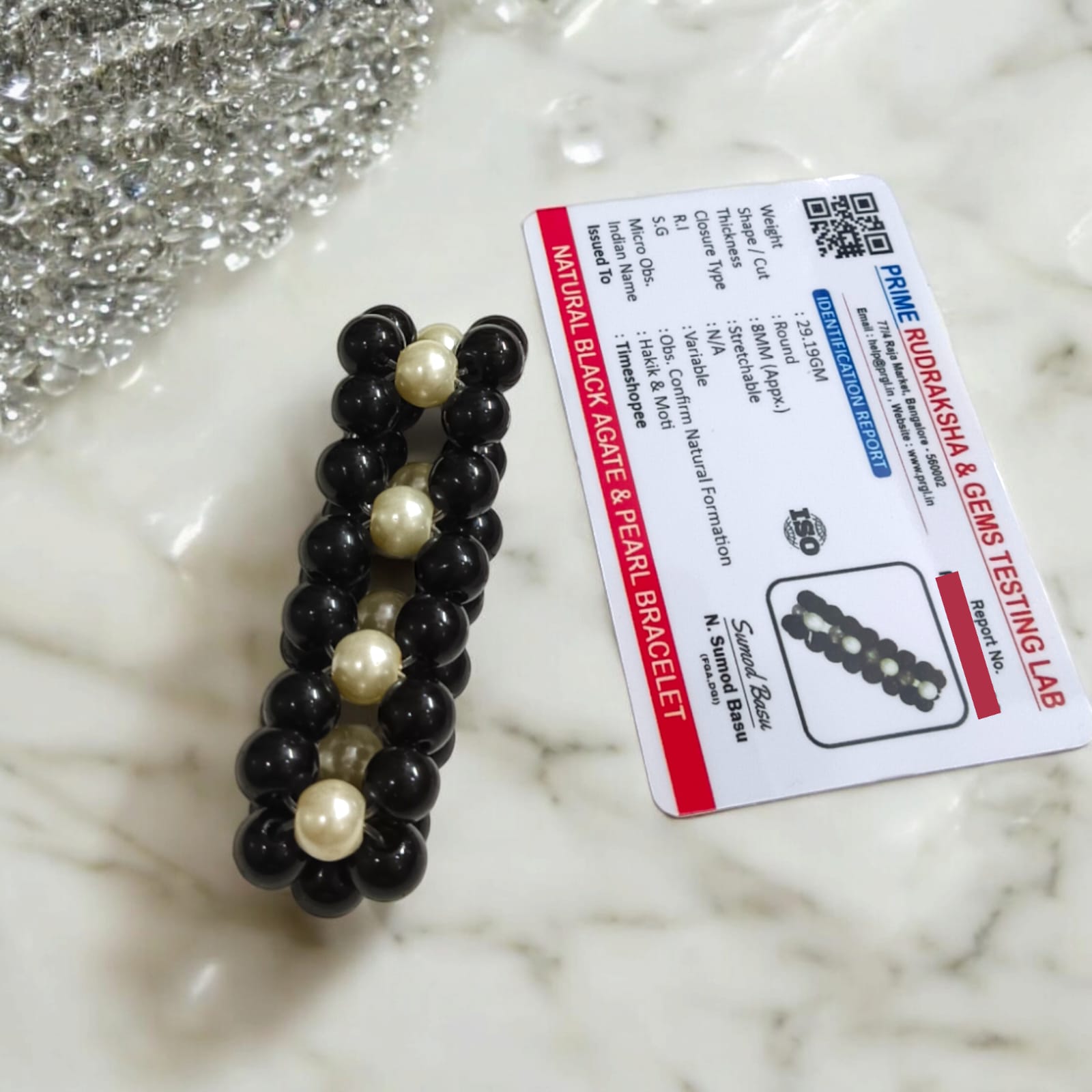 Lab-certified Black Agate and Pearl bracelet with 8MM stretchable beads, designed for protection, attraction, and spiritual growth.