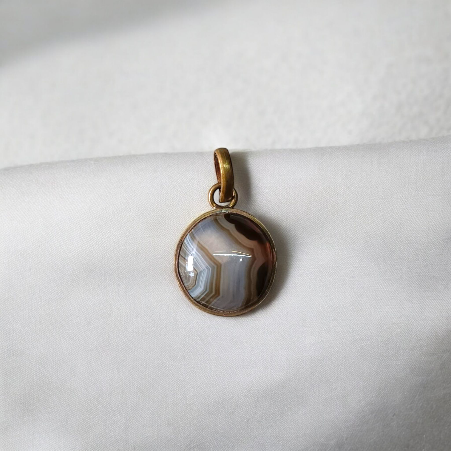 Lab-certified Black Sulemani Hakik gemstone pendant with black thread, known for protection and grounding benefits