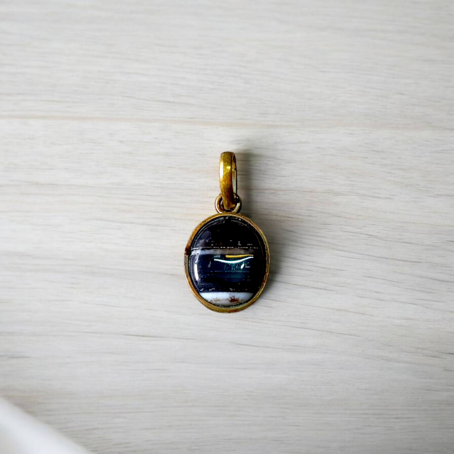 Lab-certified Black Sulemani Hakik gemstone pendant with black thread, known for protection and grounding benefits