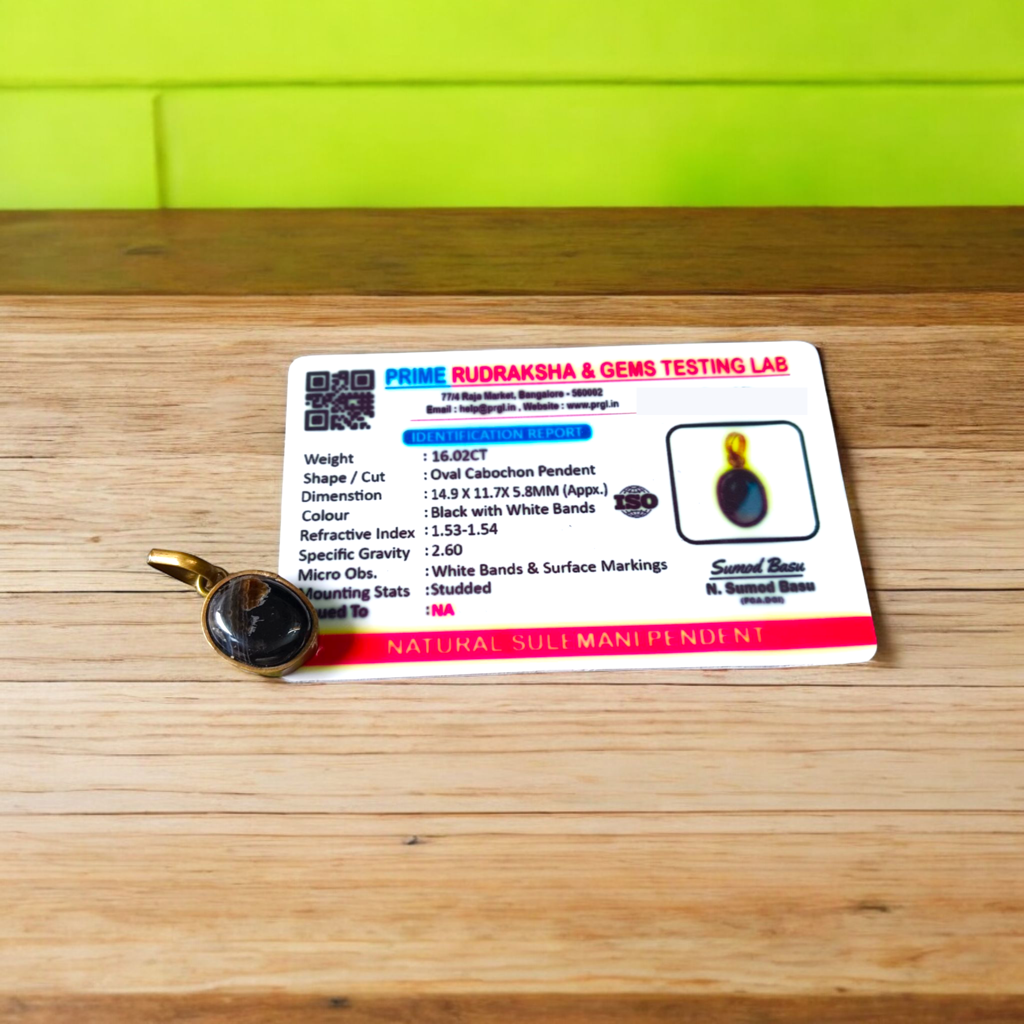 Lab-certified Black Sulemani Hakik gemstone pendant with black thread, known for protection and grounding benefits