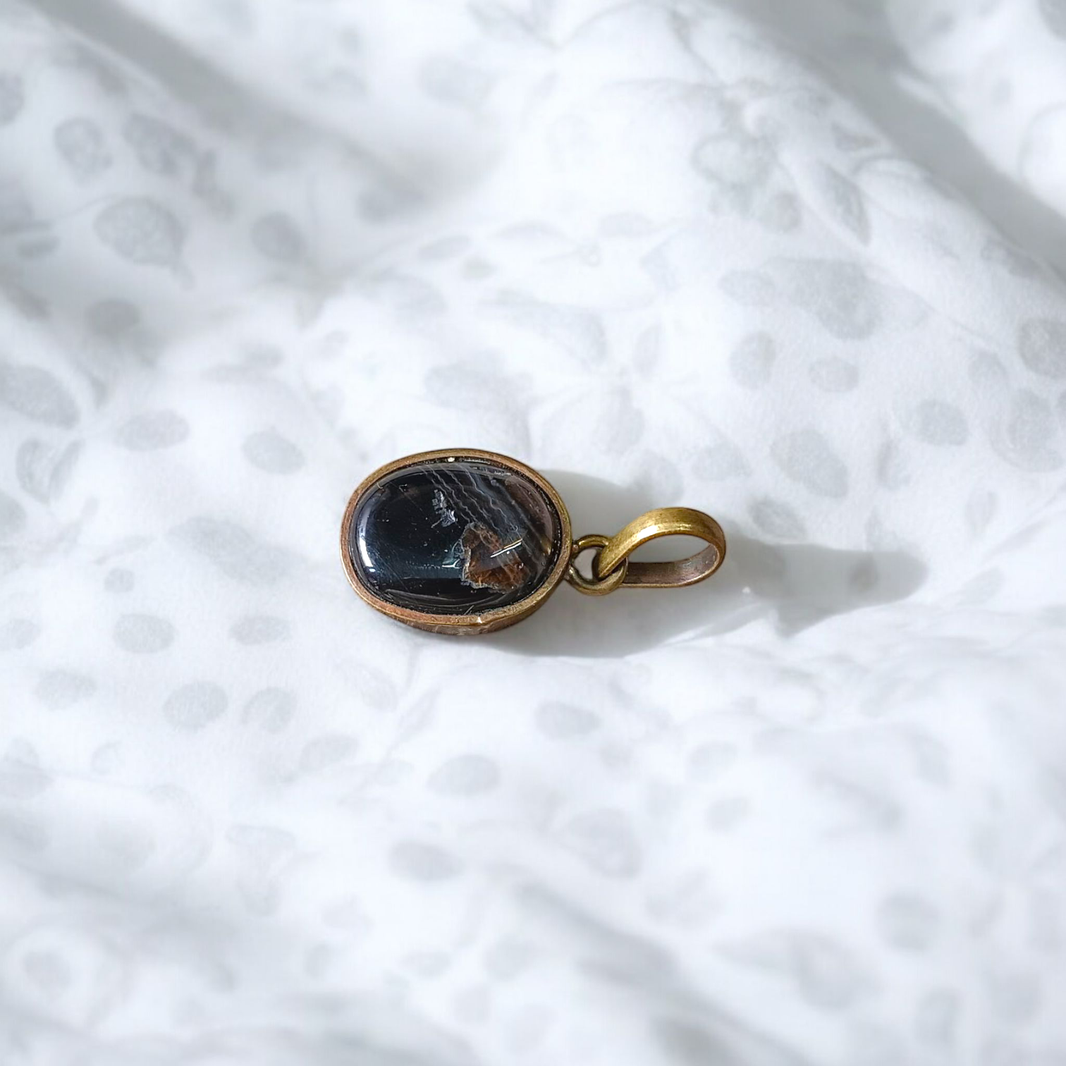 Lab-certified Black Sulemani Hakik gemstone pendant with black thread, known for protection and grounding benefits