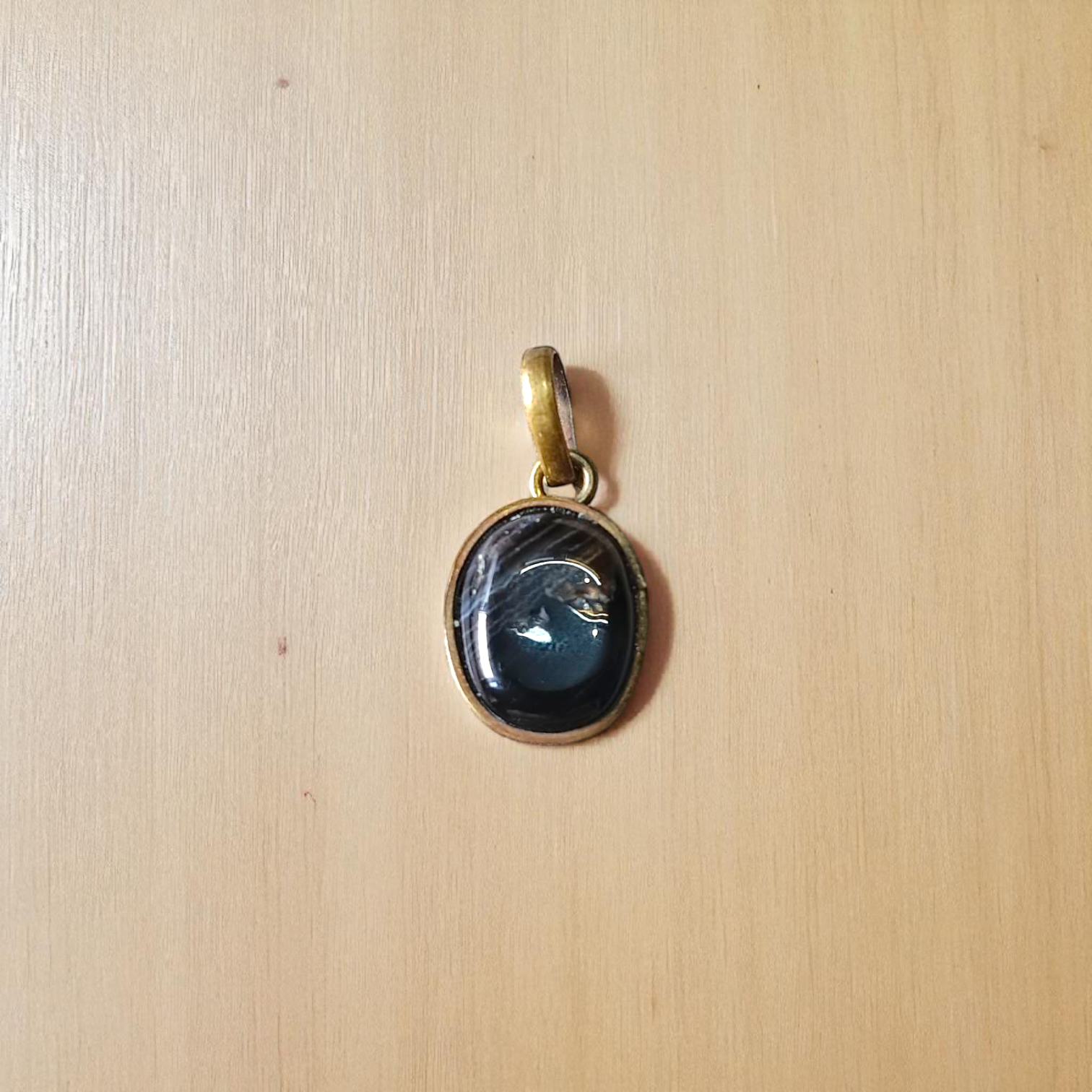 Lab-certified Black Sulemani Hakik gemstone pendant with black thread, known for protection and grounding benefits