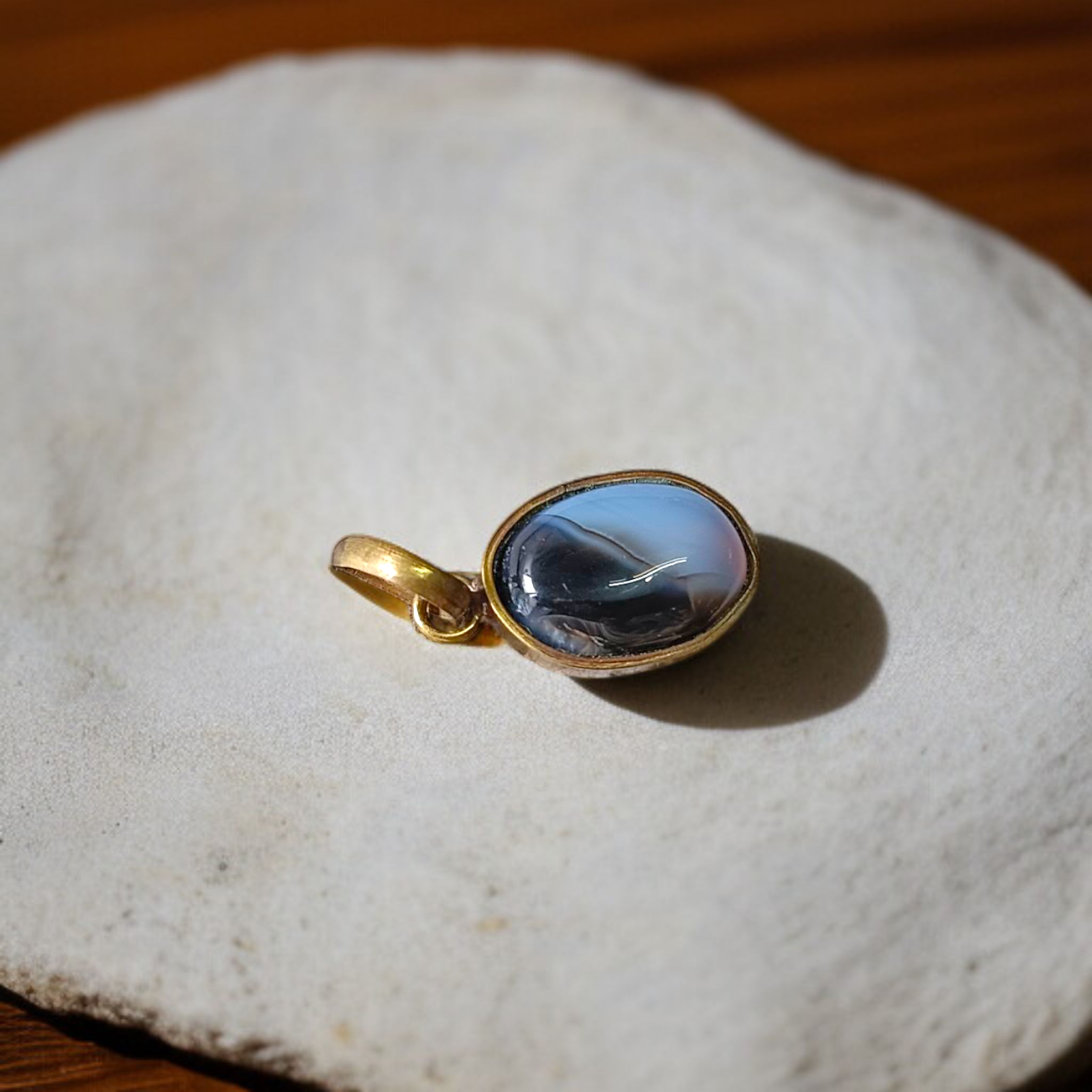 Lab-certified Black Sulemani Hakik gemstone pendant with black thread, known for protection and grounding benefits