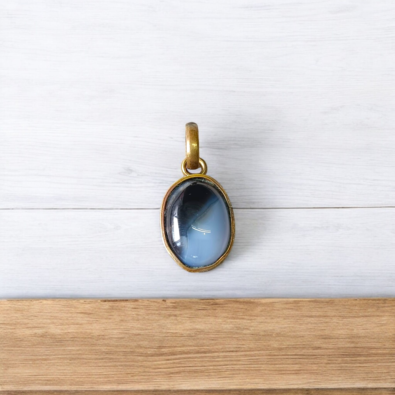 Lab-certified Black Sulemani Hakik gemstone pendant with black thread, known for protection and grounding benefits