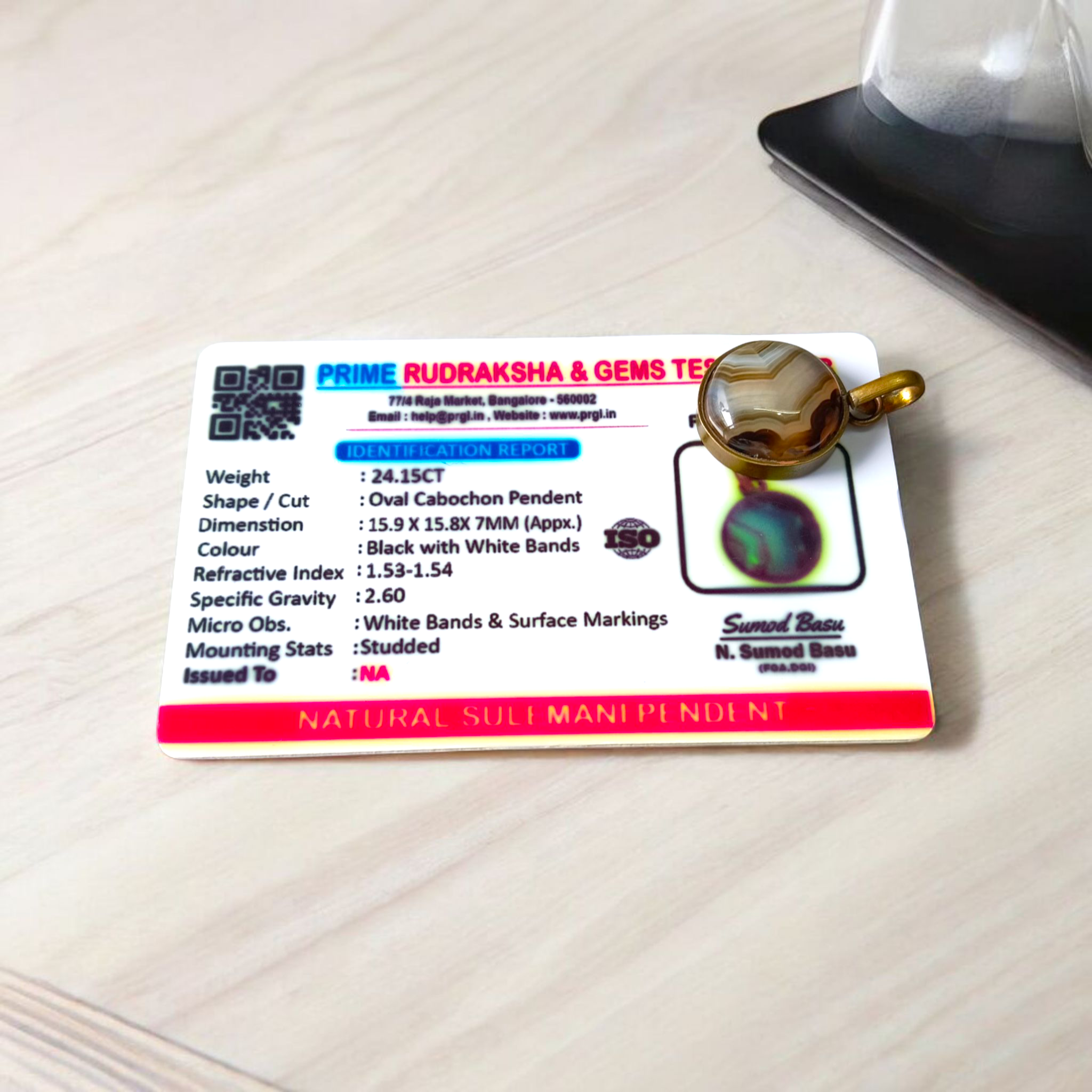 Lab-certified Black Sulemani Hakik gemstone pendant with black thread, known for protection and grounding benefits