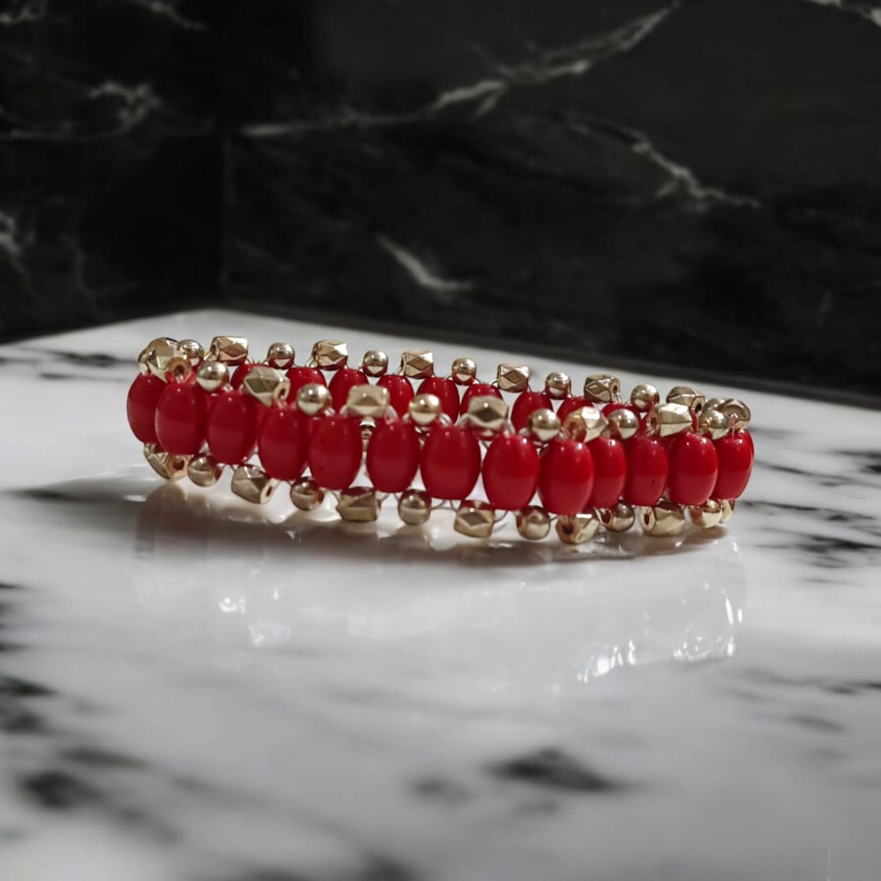 Lab-certified Lal Moonga bracelet with 8MM Red Coral beads and rose gold metal accents, stretchable for a premium, stylish look designed by Timeshopee.