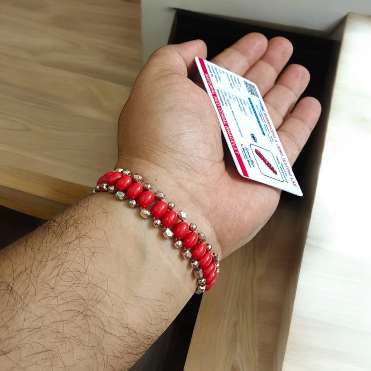 Lab-certified Lal Moonga bracelet with 8MM Red Coral beads and rose gold metal accents, stretchable for a premium, stylish look designed by Timeshopee.